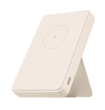Kremowa ładowarka bezprzewodowa ze stojakiem. Posiada symbol ładowania i kontrolkę. Urządzenie znajduje się na białym tle.