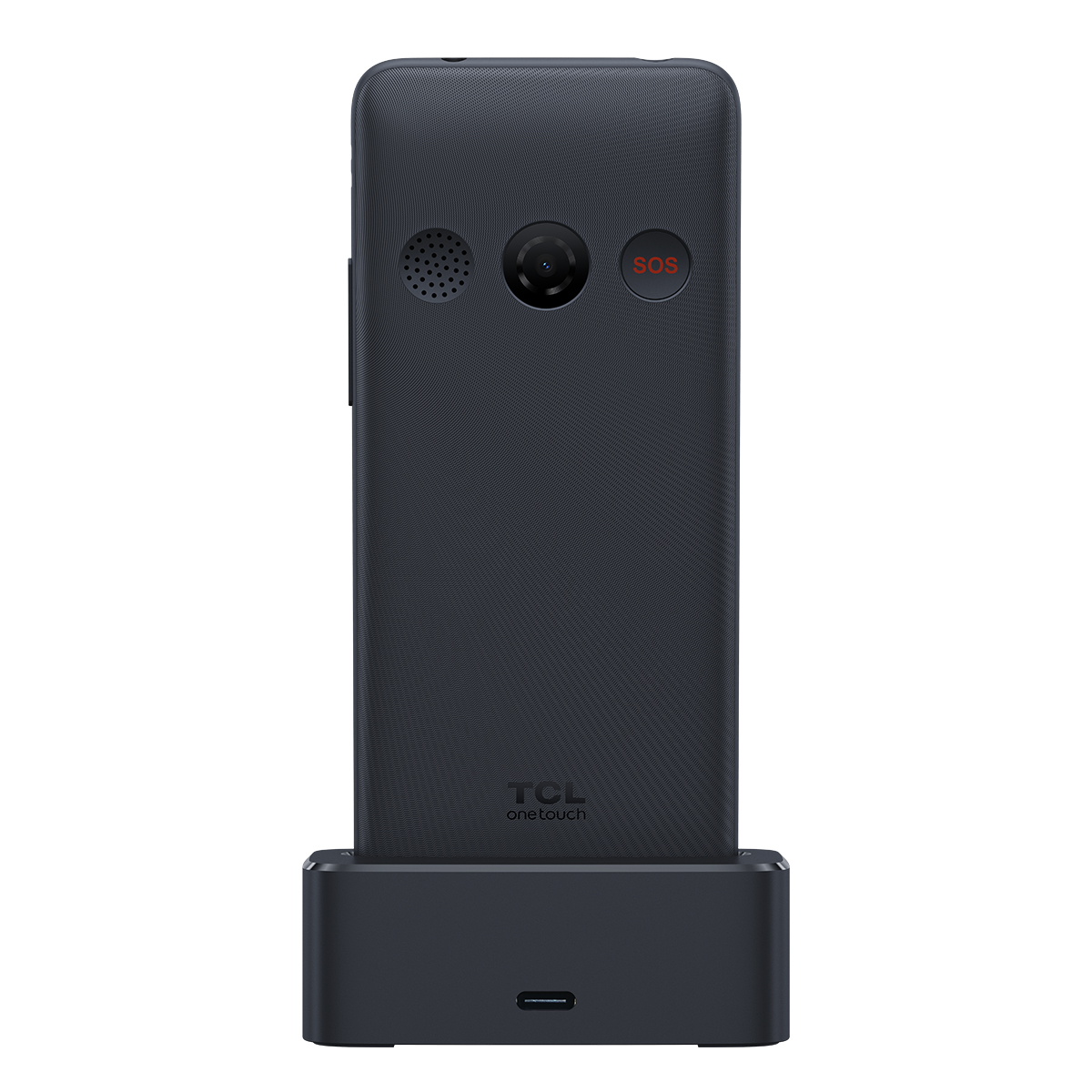 Un teléfono TCL gris oscuro en una base de carga. Tiene cámara, altavoz y botón SOS.