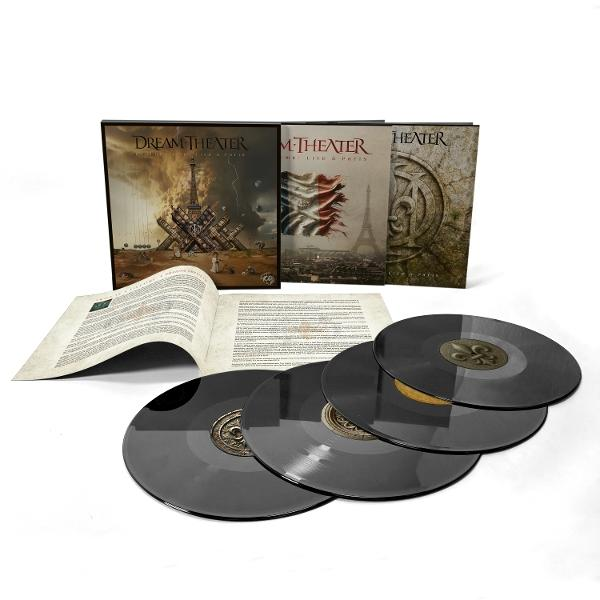 Dream Theater albumkészlet bakelit lemezekkel. A borítók az Eiffel-tornyot mutatják. Nyitott füzet és fekete bakelit lemezek elöl.