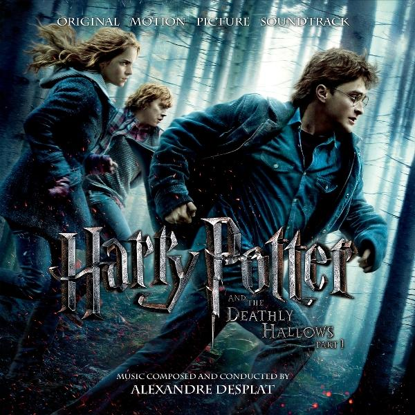 Harry Potter filmplakát. Harry, Hermione és Ron egy erdőben futnak. Cím: Harry Potter és a Halál ereklyéi 1. rész.