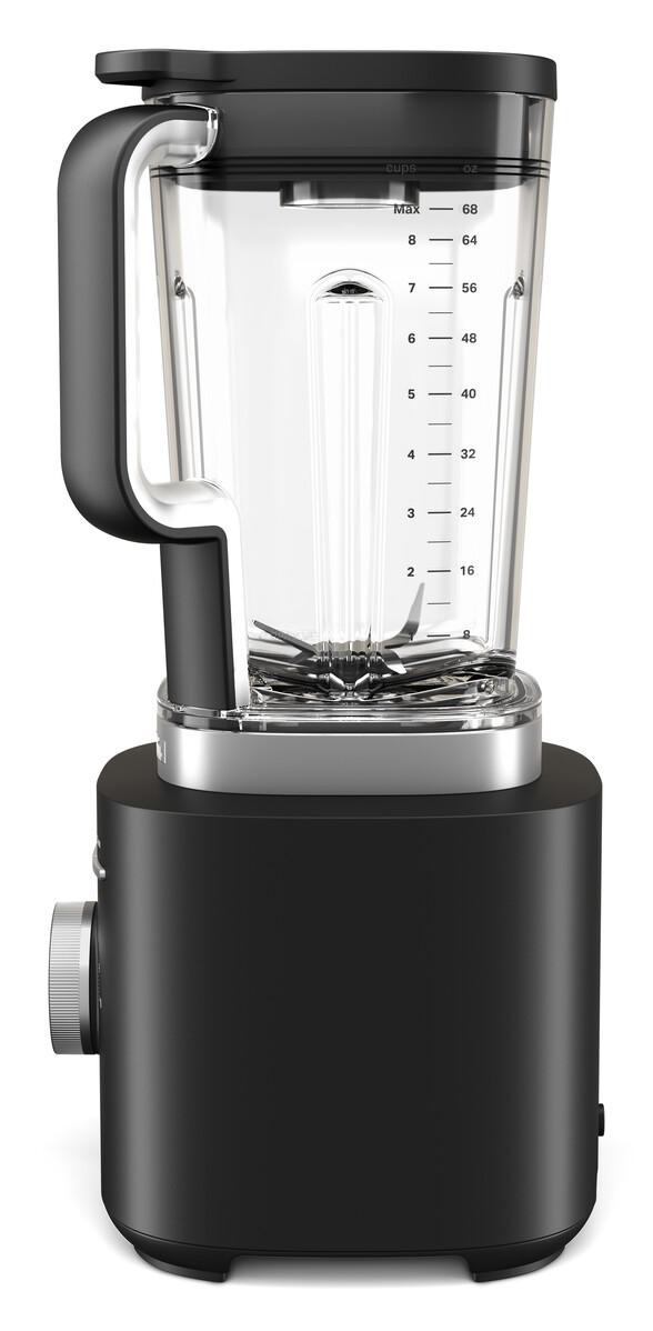 Ein schwarzer Mixer mit einem durchsichtigen Krug mit Maßen. Er hat einen Griff und ein Zifferblatt. Der Mixer steht auf einer weißen Oberfläche.