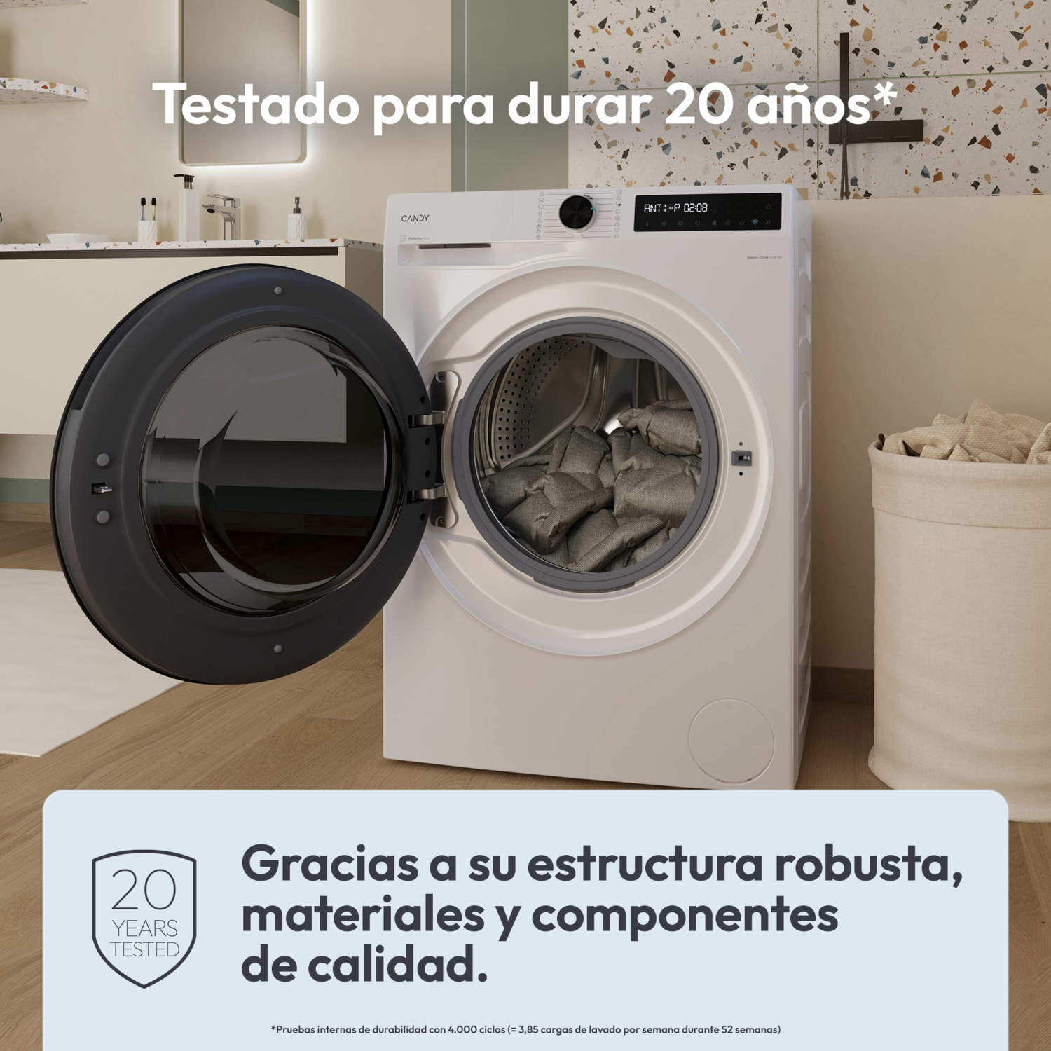 Una lavadora con la puerta abierta. El texto dice 'Probado durante 20 años'. Hay una cesta de lavandería a la derecha. La máquina es blanca.