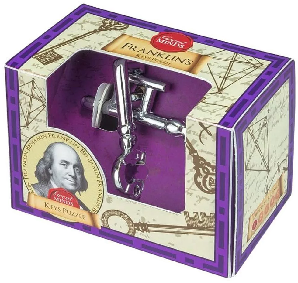 Egy doboz, amely a 'Franklin's Keys Puzzle'-t mutatja. A puzzle egy ezüst kulcs. A dobozon Benjamin Franklin portréja látható.