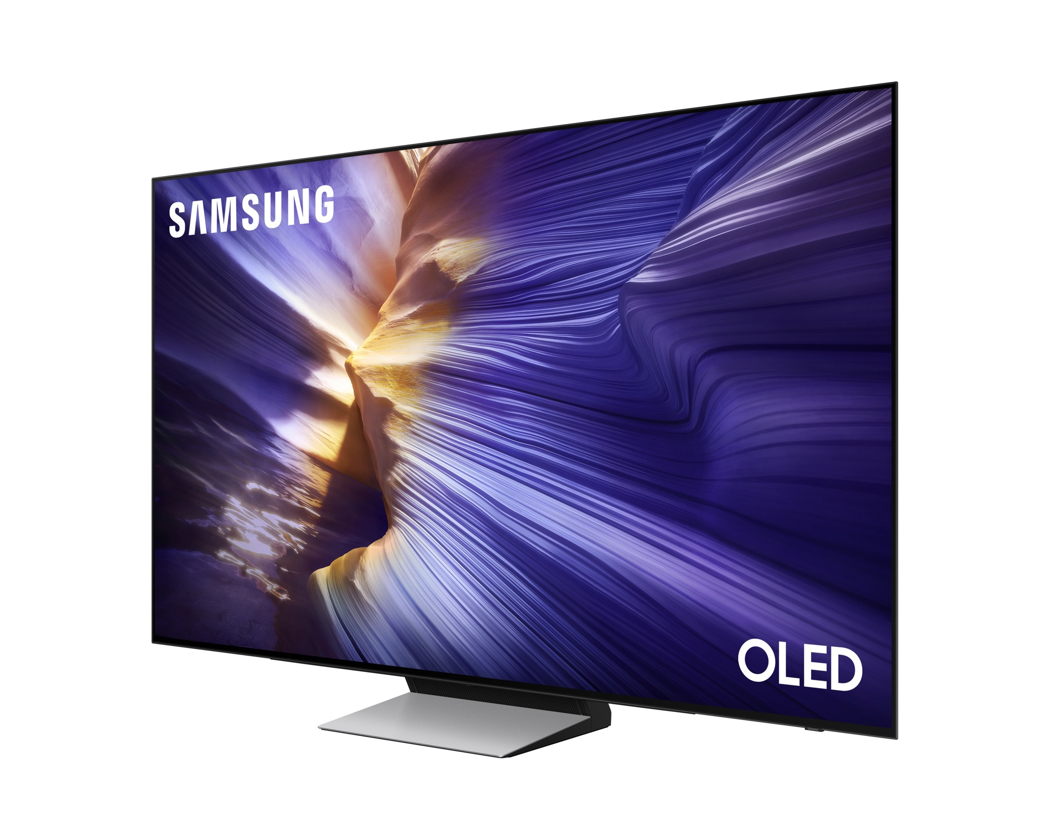 Egy Samsung OLED TV lila és sárga örvénylő absztrakt képet mutat. A TV egy ezüst állványon van.