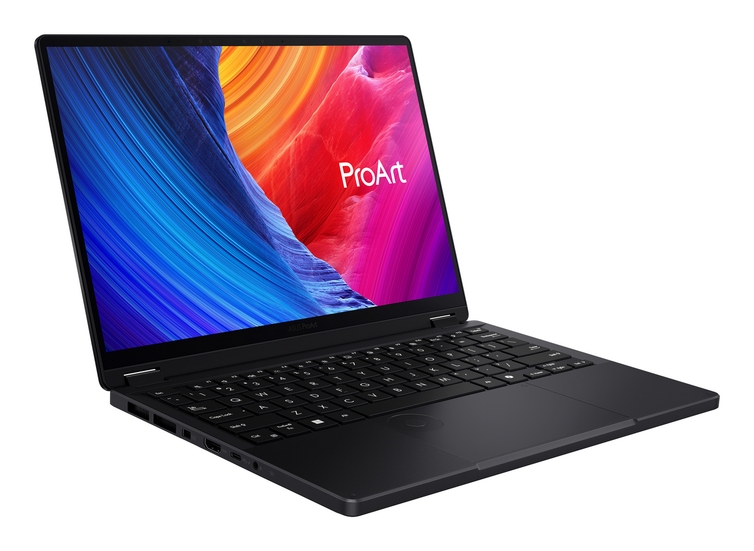 Portátil negro con pantalla colorida mostrando el logo 'ProArt'. Teclado y panel táctil visibles. Fondo blanco.