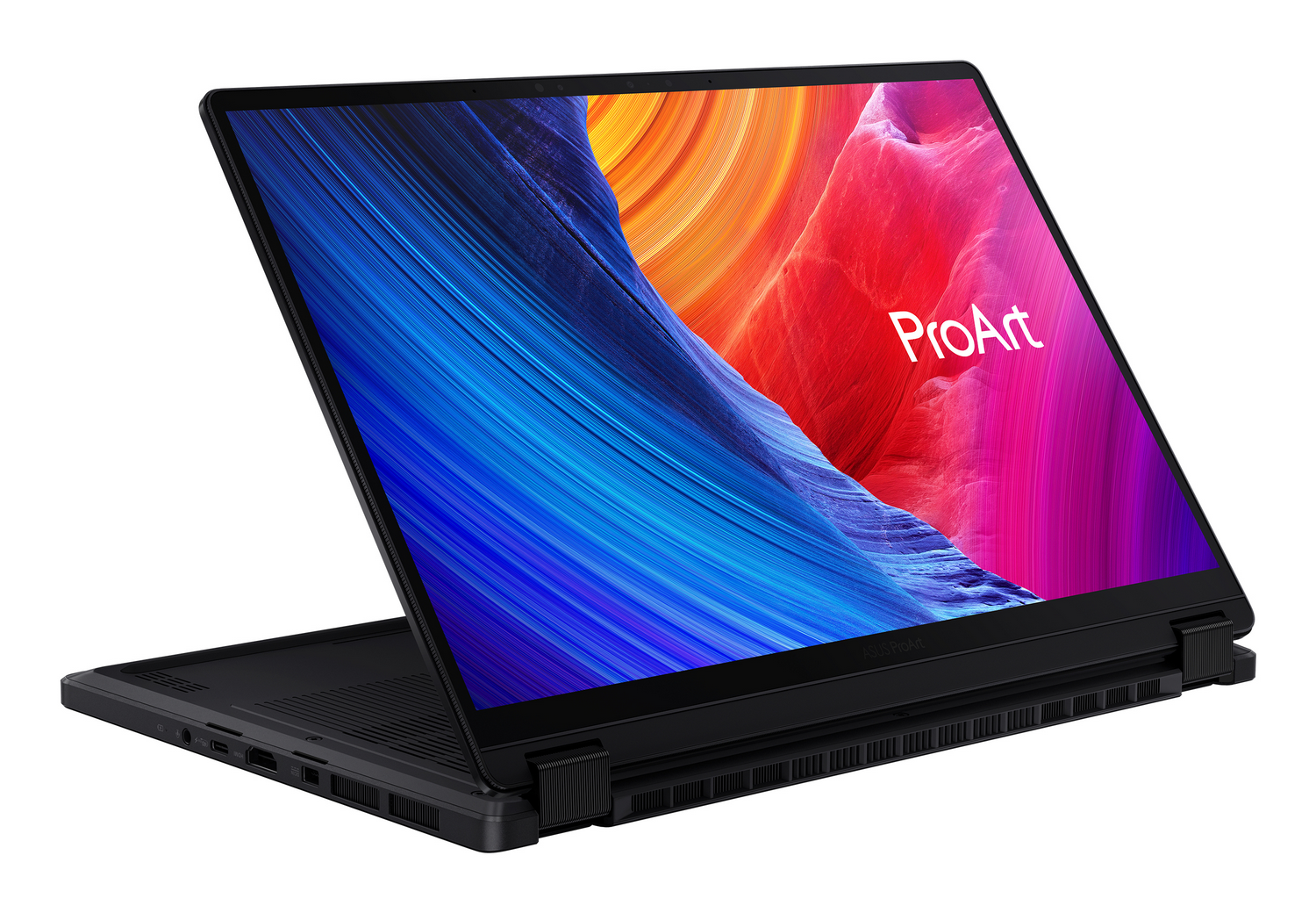 Portátil negro con pantalla de colores abstractos. La pantalla está abierta, mostrando teclado y base. Se ve la palabra 'ProArt'.