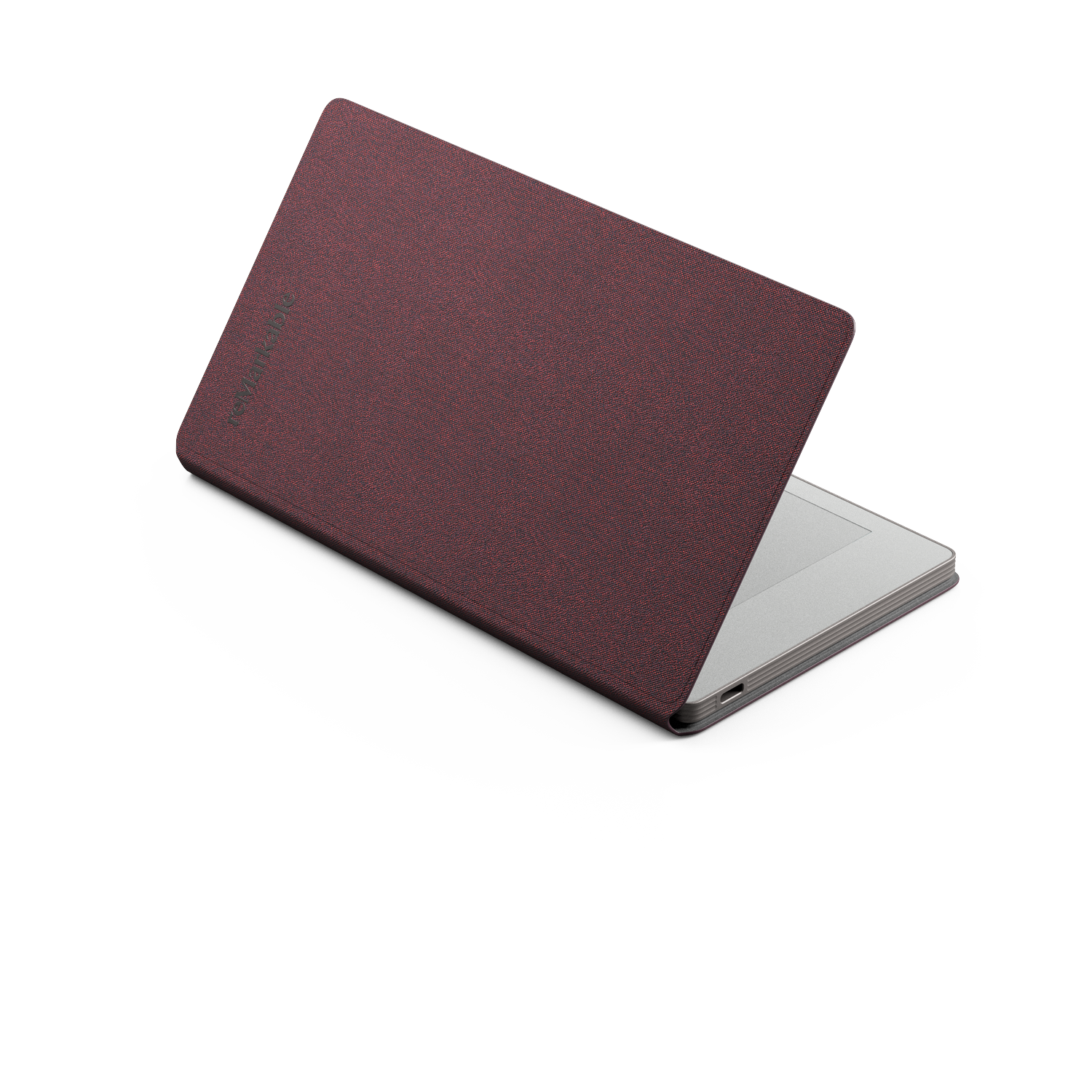 A laptop with a maroon fabric cover is on a white surface. The laptop is partially open, displaying a silver keyboard.