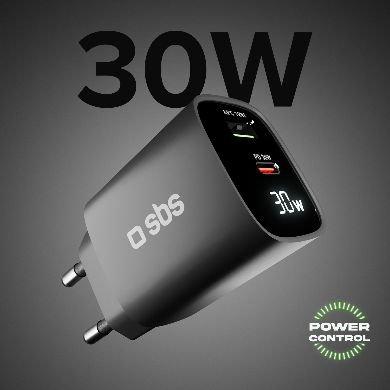 Un caricatore grigio da 30W con display dello stato di alimentazione. Il logo 'sbs' è visibile. Sono presenti anche le scritte 'POWER CONTROL' e '30W'.