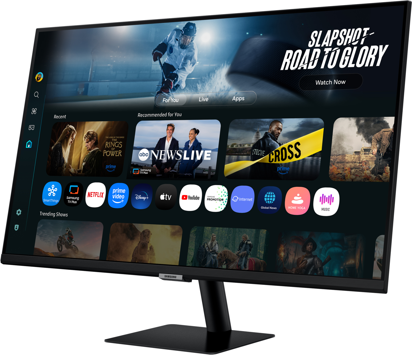 Un moniteur noir affiche une interface de service de streaming. Les émissions incluent des sports, des actualités et des recommandations de films. Le moniteur est sur un support noir.