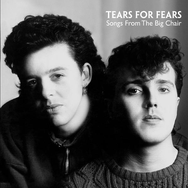 Fekete-fehér fotó két férfiról. Az egyik cipzáros kabátot, a másik pulóvert visel. A szöveg: 'Tears for Fears Songs From The Big Chair'.
