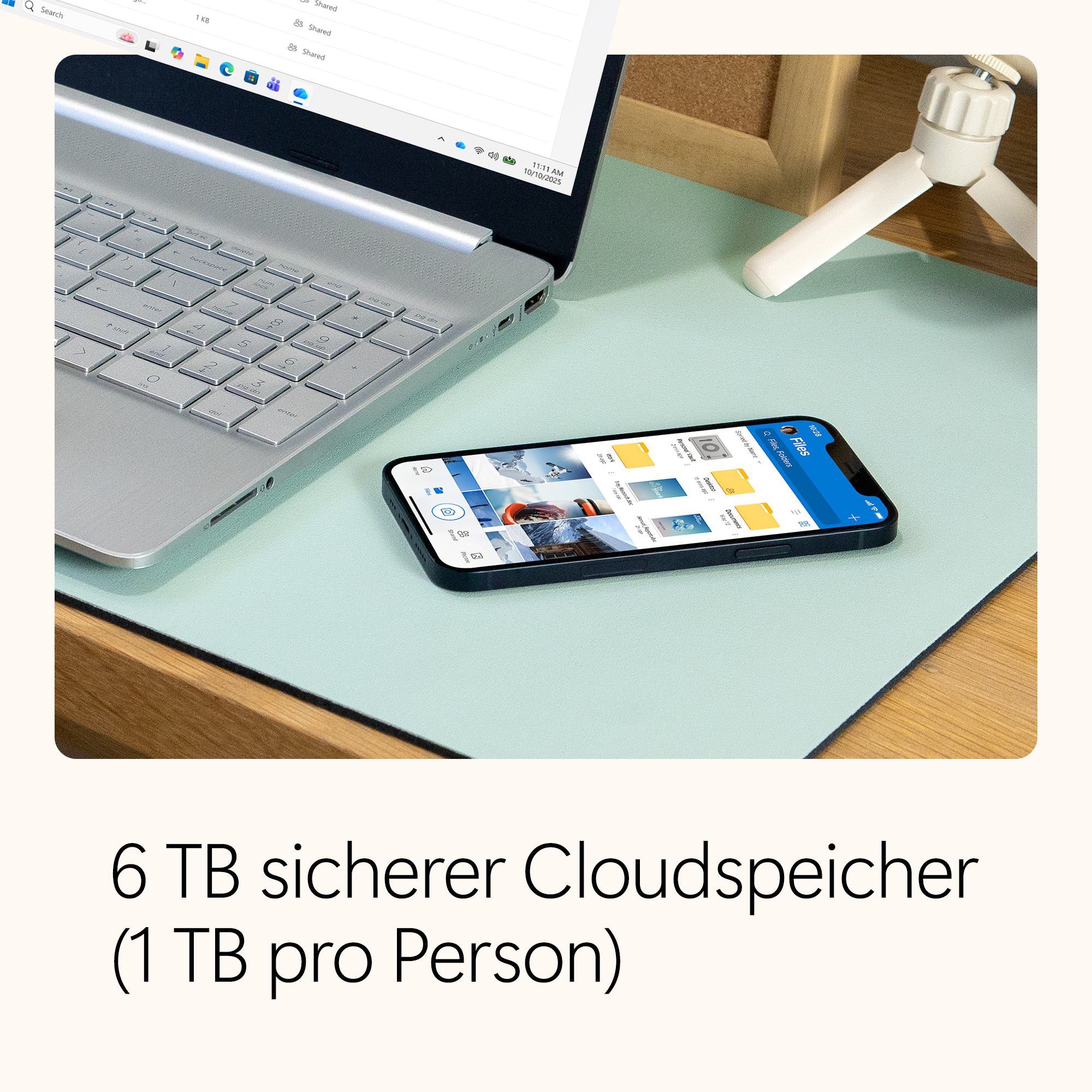 Laptop, Telefon auf einem Schreibtisch. Telefon zeigt Dateien an. Text unten: '6 TB sicherer Cloud-Speicher'.