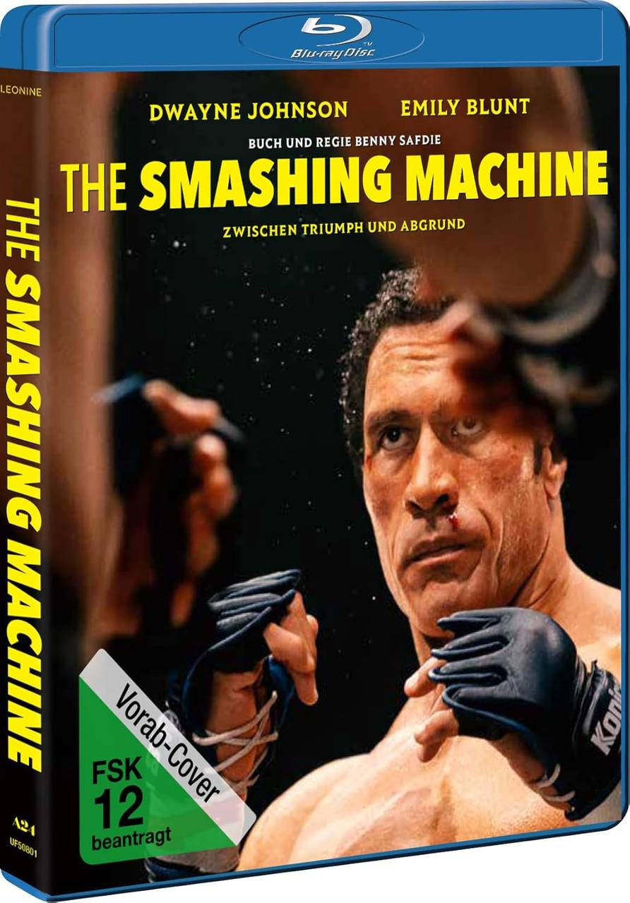 Blu-ray-Cover für The Smashing Machine. Dwayne Johnson und Emily Blunt sind zu sehen. Ein verletzter Mann starrt intensiv.