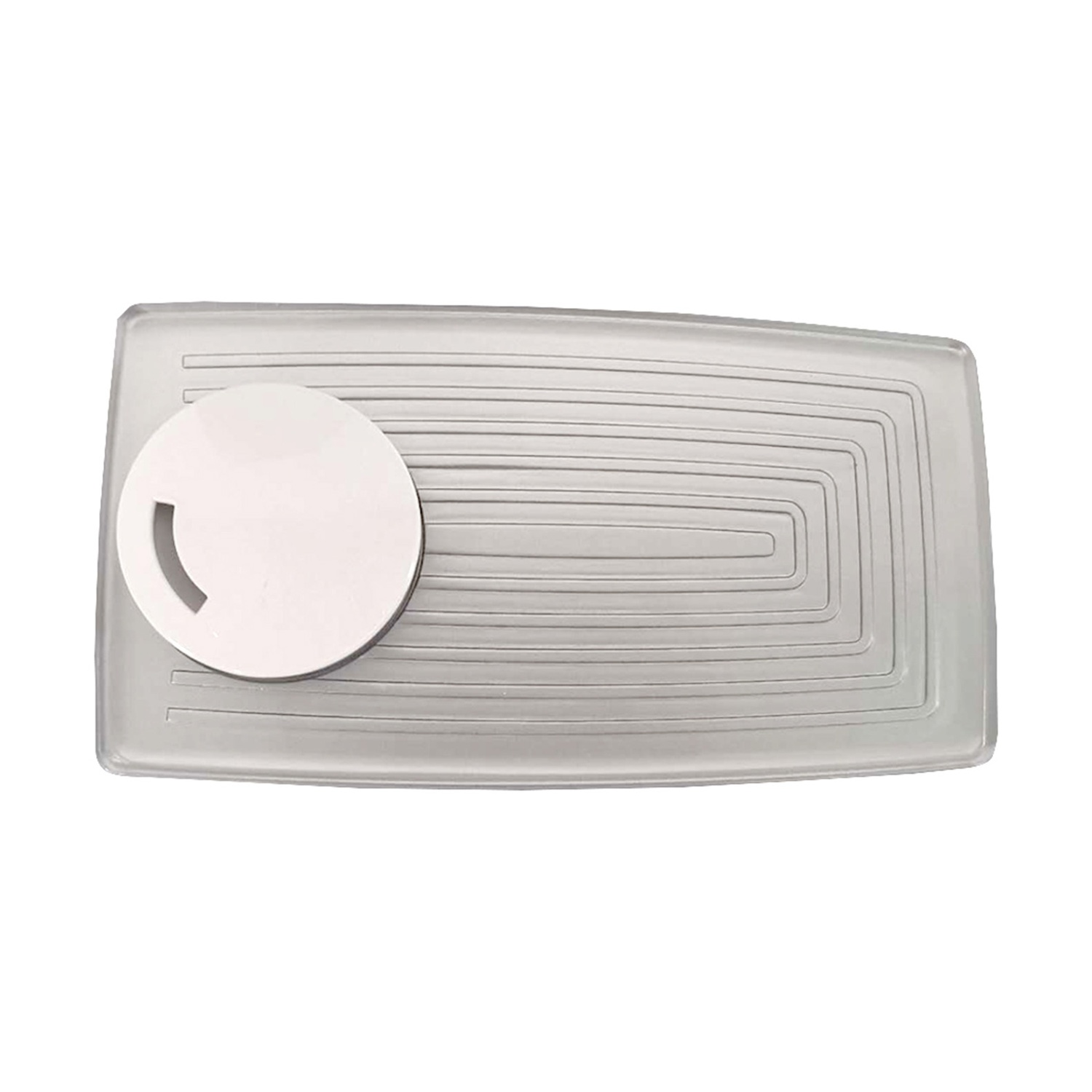 Un portasapone rettangolare e trasparente con un porta sapone circolare bianco. Il piatto ha una superficie strutturata con rettangoli concentrici.