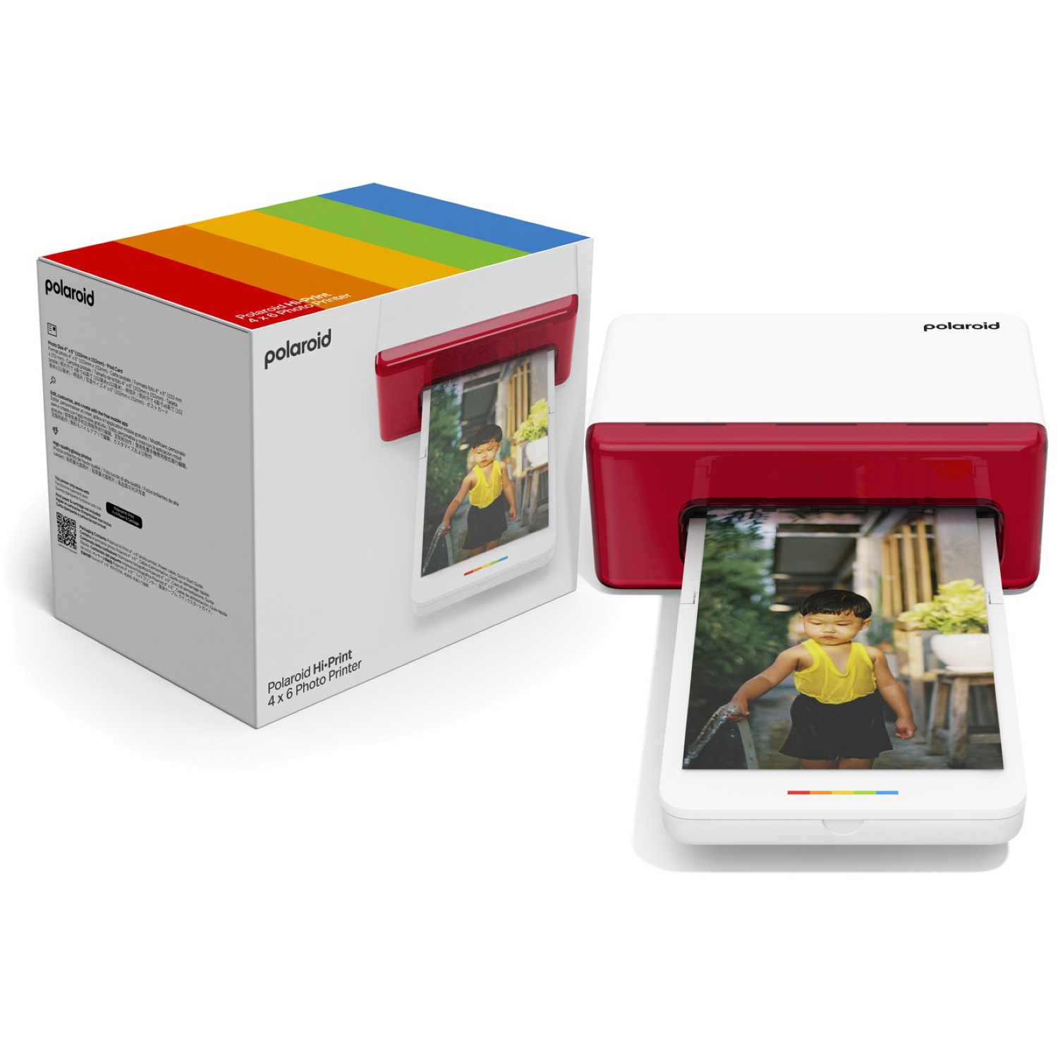 A Polaroid Hi-Print 4x6 photo printer and its box. The printer is white and red, printing photos. The box has a rainbow design.