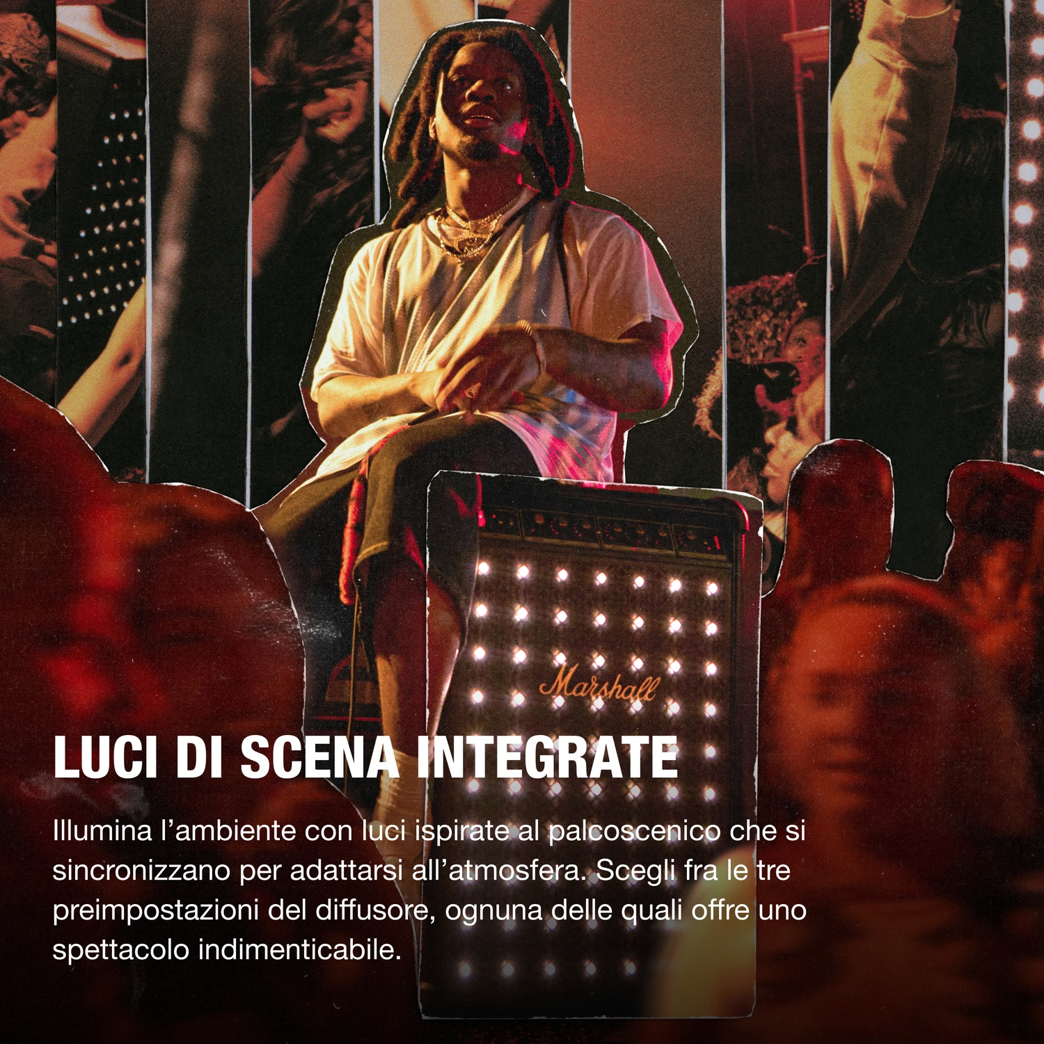 Un uomo con i dreadlocks è seduto vicino a un amplificatore Marshall. Lo sfondo include luci di scena e sagome di persone.