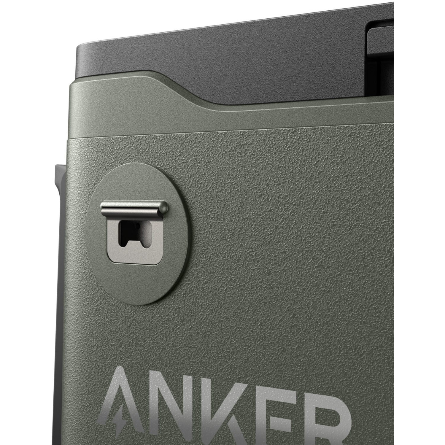 Close-up of a green Anker product. Features a bottle opener, textured surface, and the Anker logo. Black top portion present.