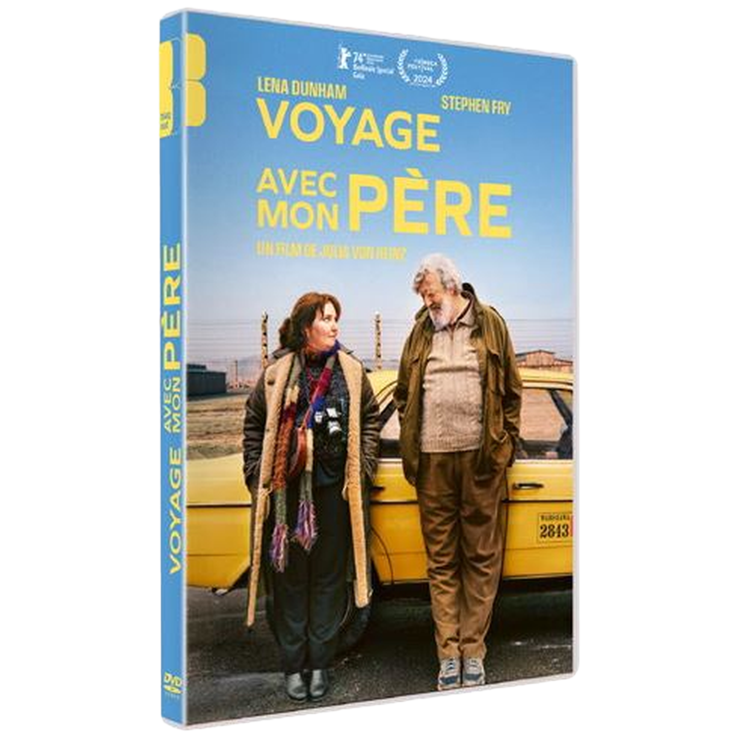 Couverture DVD de 'Voyage Avec Mon Père'. Montre deux personnes près d'une voiture jaune. Le texte inclut les noms des acteurs et le titre du film.