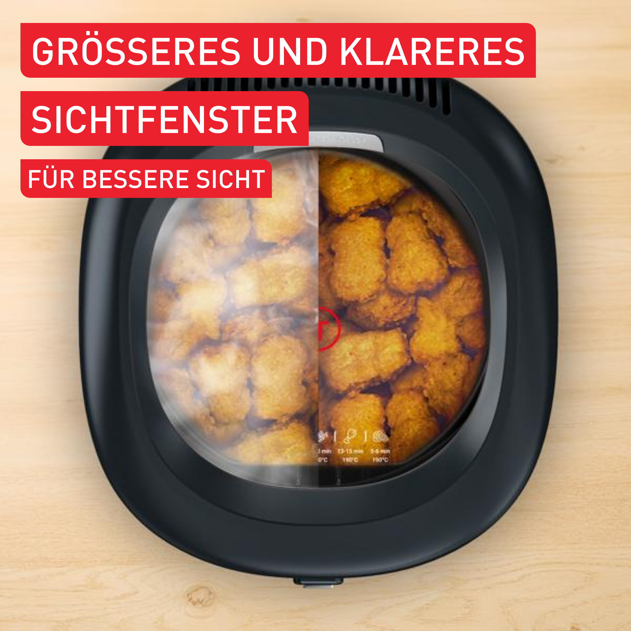 Eine Heißluftfritteuse mit einem Sichtfenster, das frittiertes Essen zeigt. Roter Text: 'Größeres und klareres Sichtfenster'.