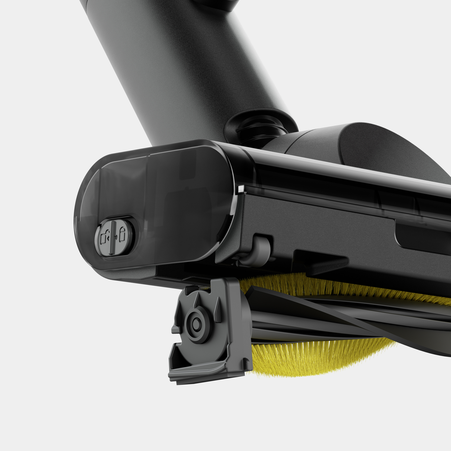 Close-up of a black vacuum cleaner head with yellow brush bristles. A clear plastic cover and various mechanical parts are visible.
