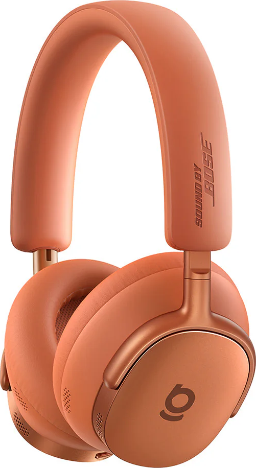 Ein Paar orangefarbene Bose-Kopfhörer. Die Ohrmuscheln sind rund, und das Kopfband ist gebogen. Bose-Logo ist sichtbar.