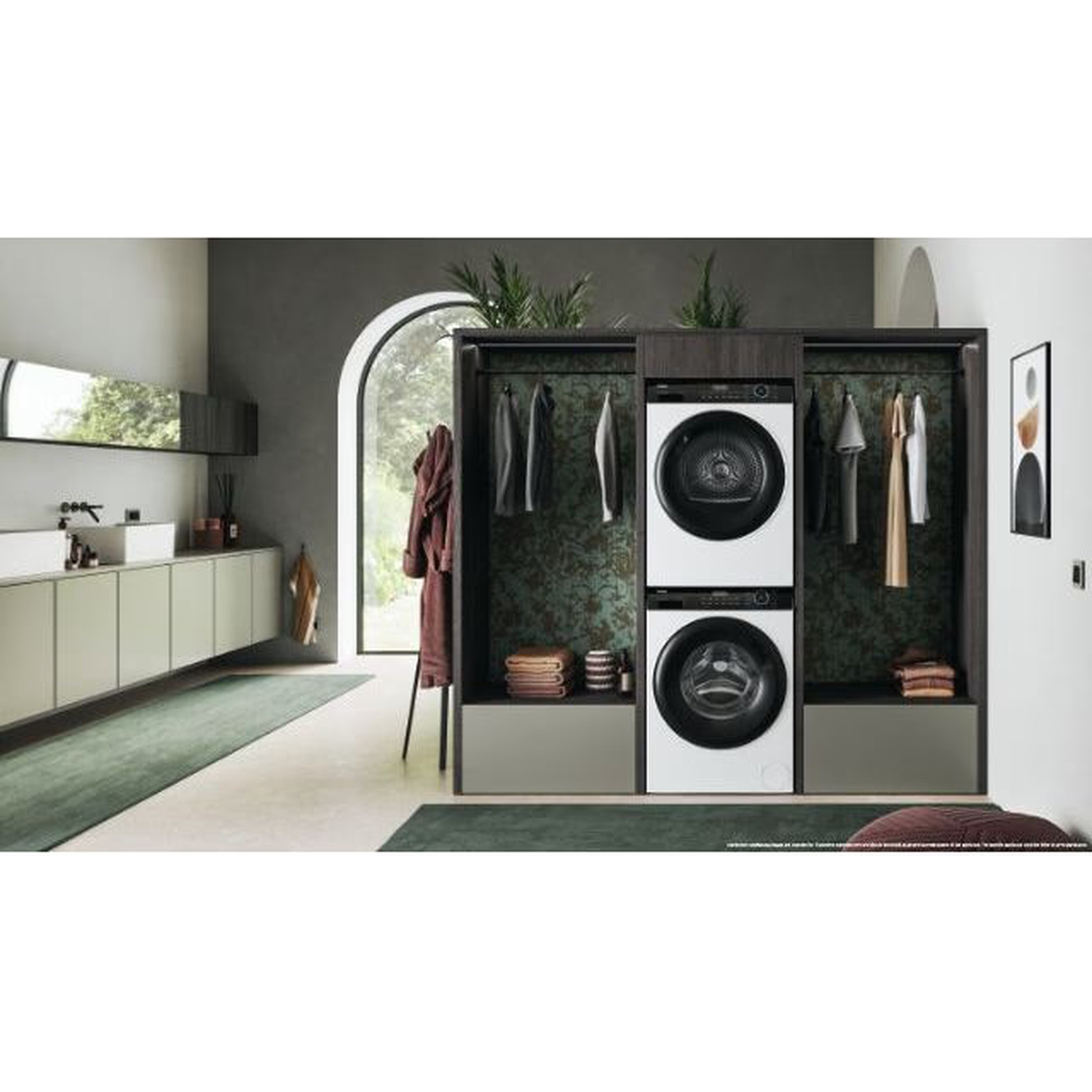 Laundry room with a washer and dryer. Clothes hanging on the rack. Green carpet. White and grey cabinets. Window with a view.