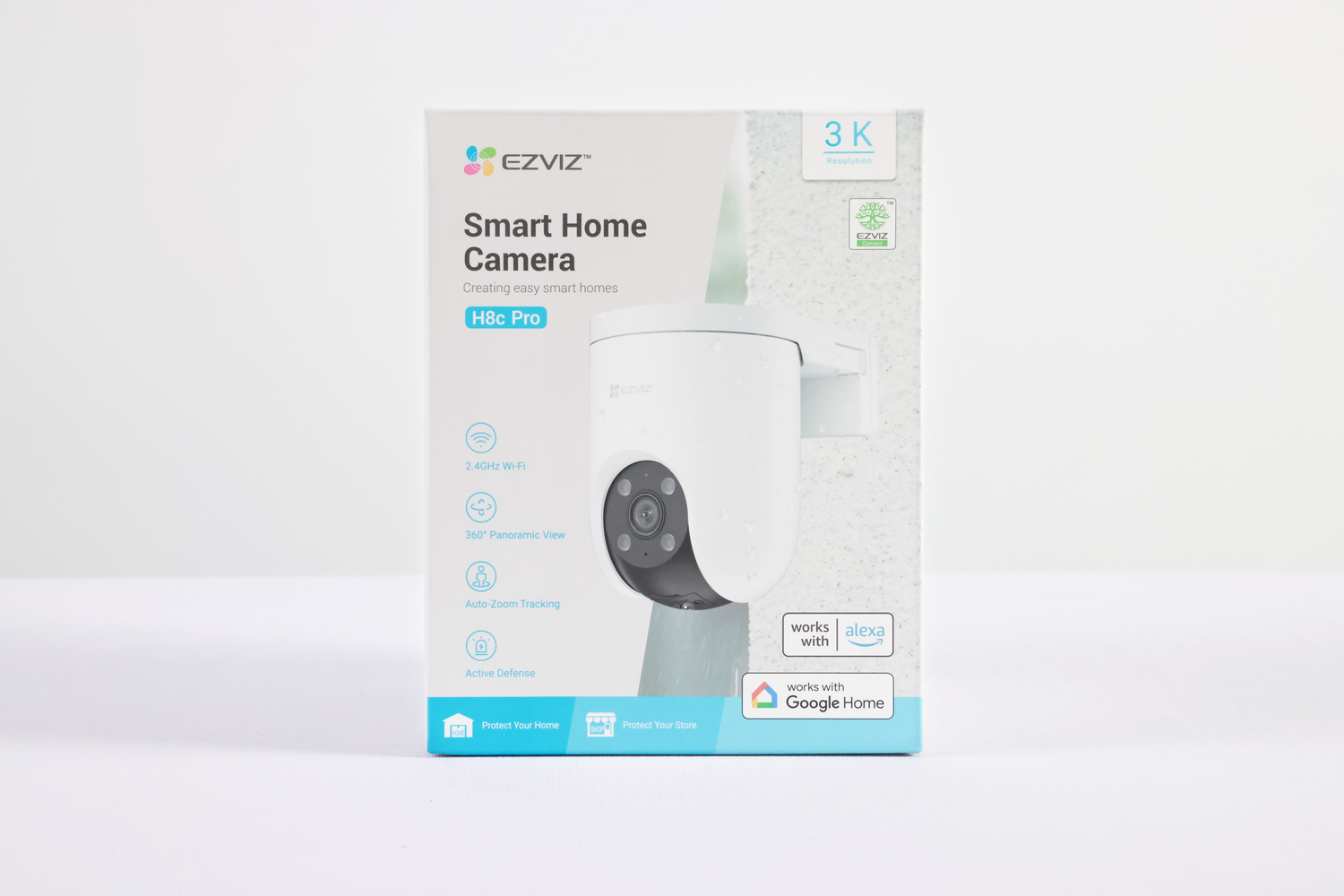 Una caja blanca de la cámara EZVIZ Smart Home con el modelo H8c Pro. La caja muestra la cámara y características como Wi-Fi y vista panorámica.