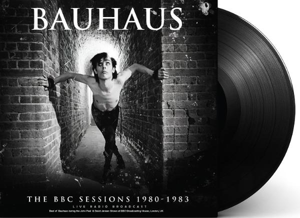 A Bauhaus album borítója. Egy férfi egy alagútban, kinyújtott karokkal. Vinil a jobb oldalon. Fekete-fehér.