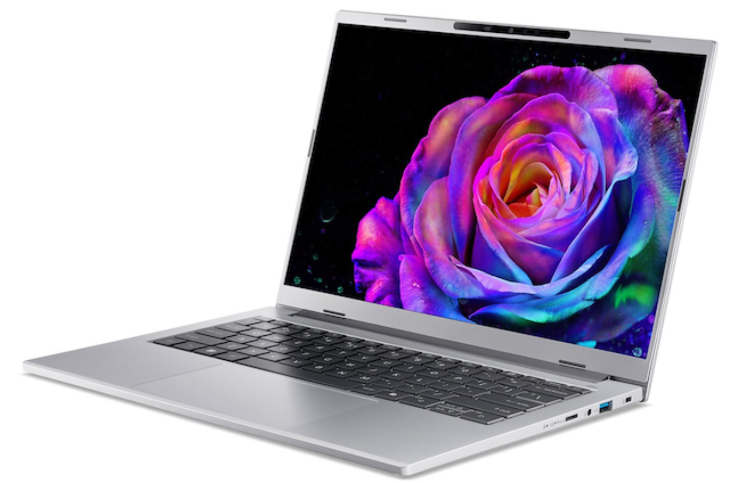 Una laptop plateada muestra una rosa vibrante en su pantalla. El teclado es negro. El fondo es blanco.