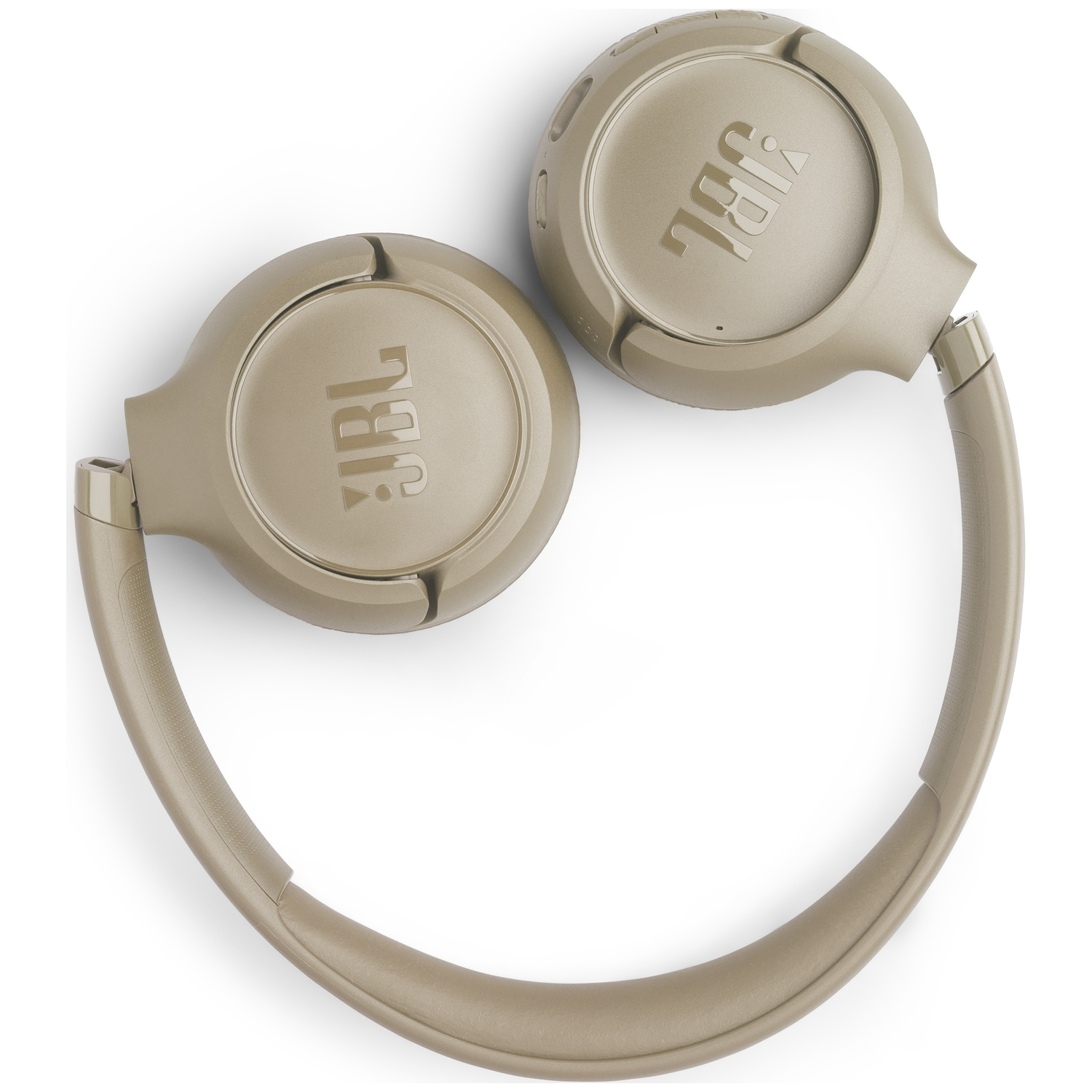 Casque JBL beige sur une surface blanche. Les écouteurs sont visibles, avec le logo JBL. L'arceau est courbé en bas.