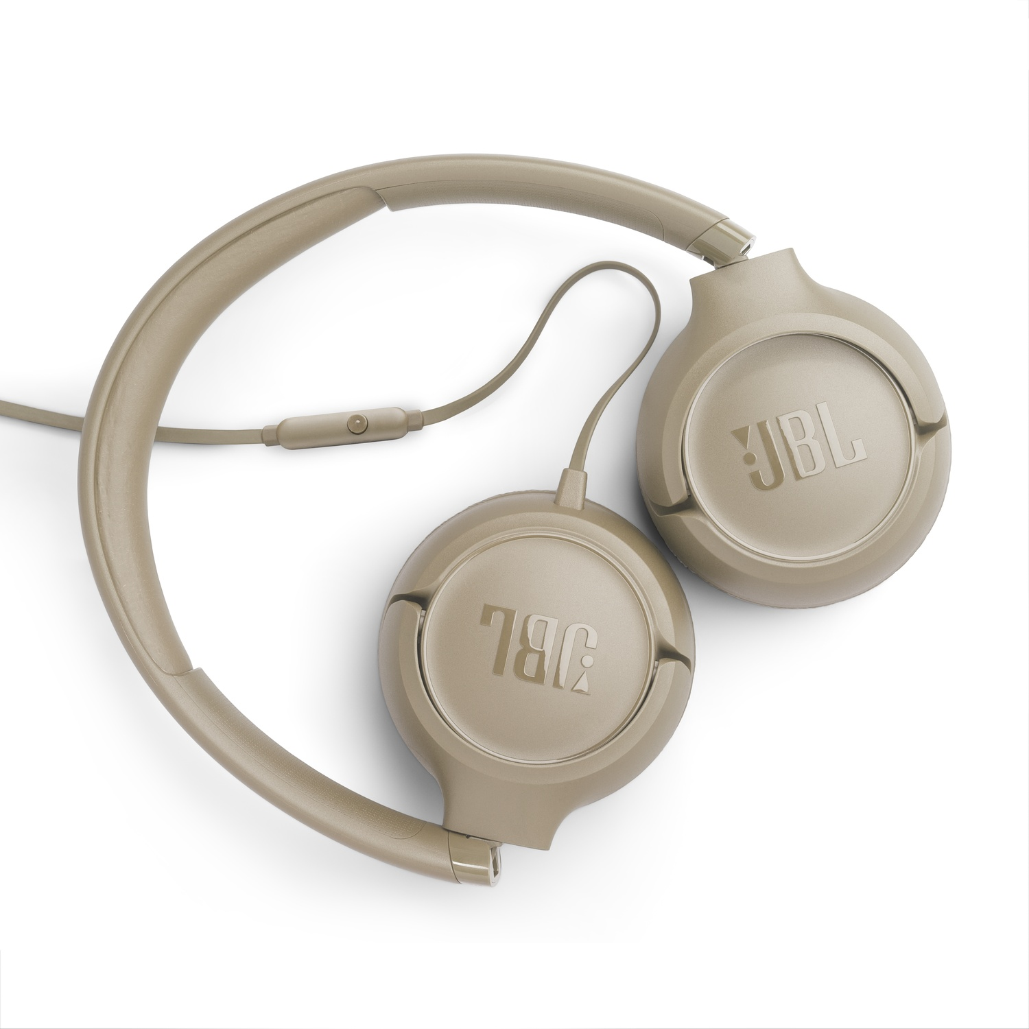 Casque JBL couleur beige sur fond blanc. Le casque est de type circum-auriculaire avec le logo JBL visible sur chaque écouteur.
