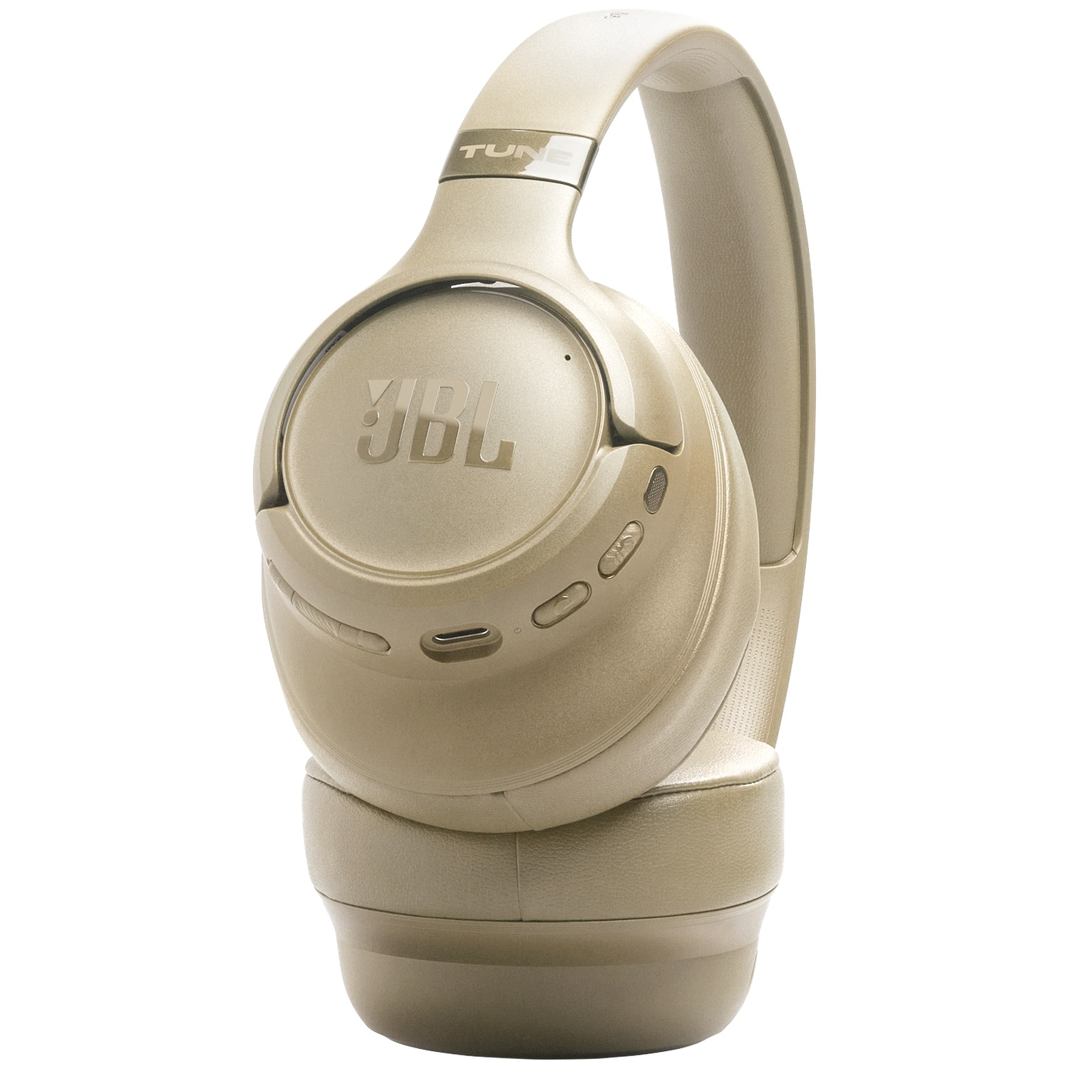 Un casque circum-auriculaire sans fil JBL Tune 760NC beige sur fond blanc. Le casque est incliné, montrant les oreillettes et le bandeau.