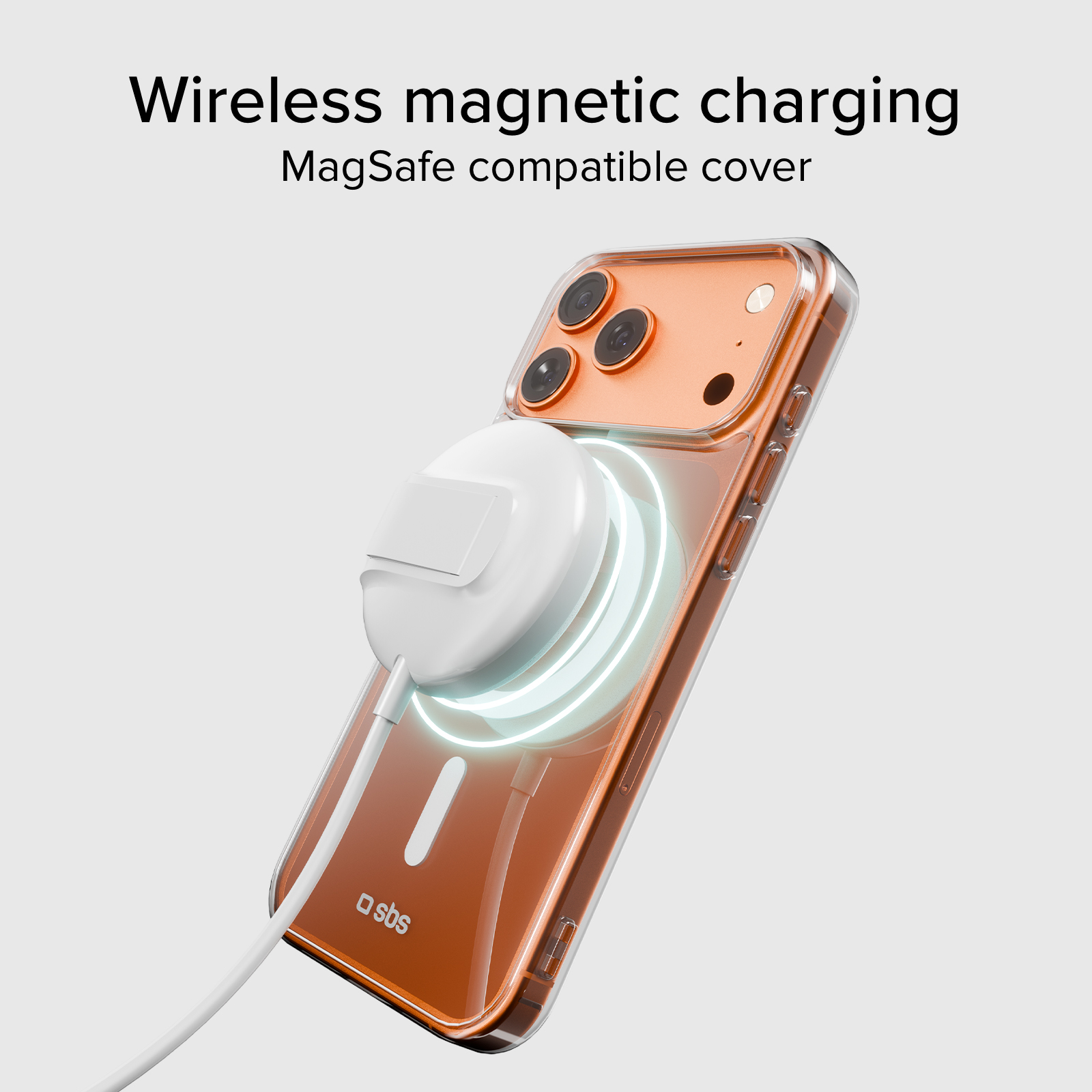 Telefon z przezroczystym etui, ładowany bezprzewodowo za pomocą białej ładowarki magnetycznej. Telefon ma trzy aparaty.