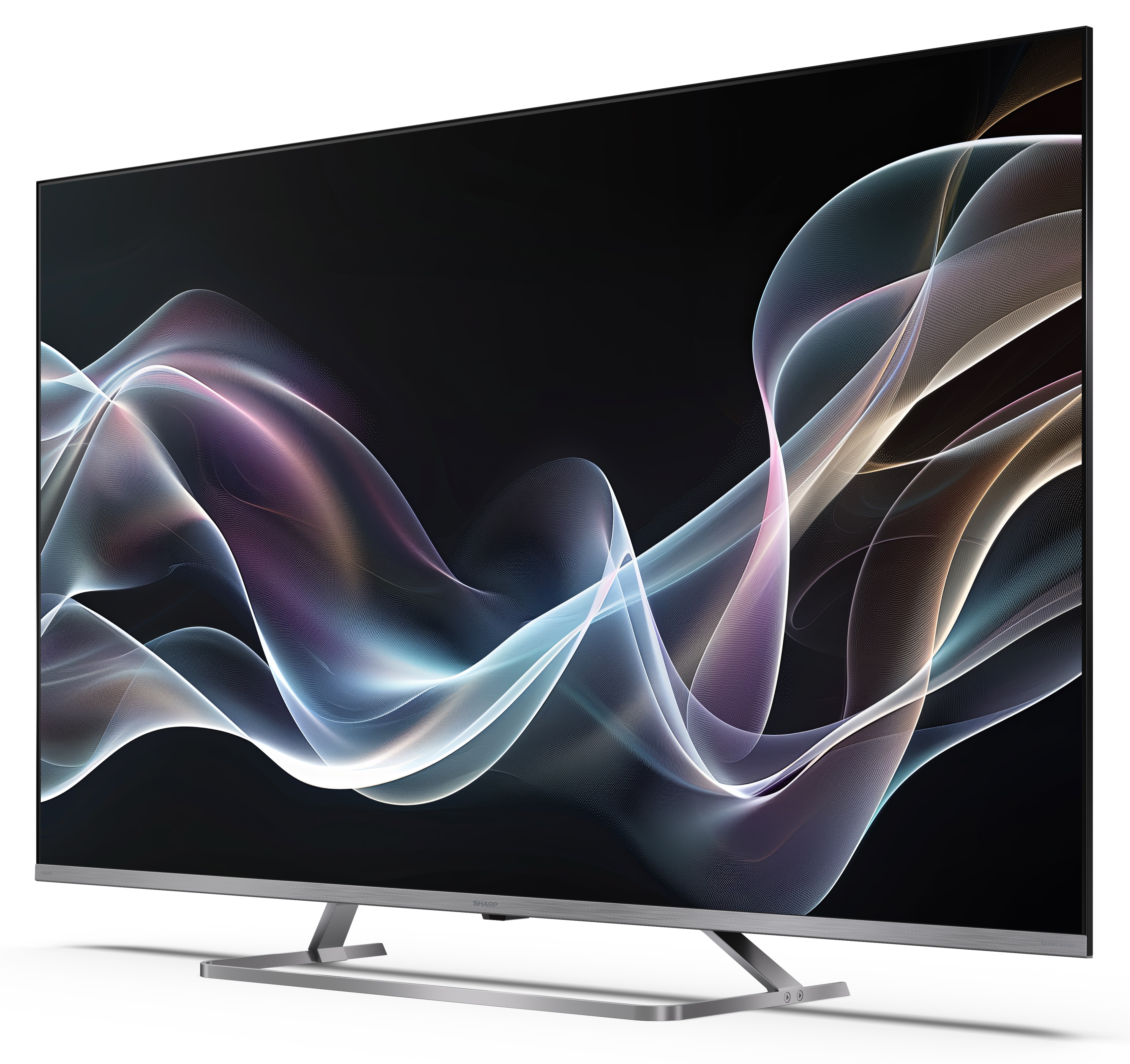 Duży, srebrny telewizor wyświetla abstrakcyjne, płynące linie w różnych kolorach na czarnym tle.