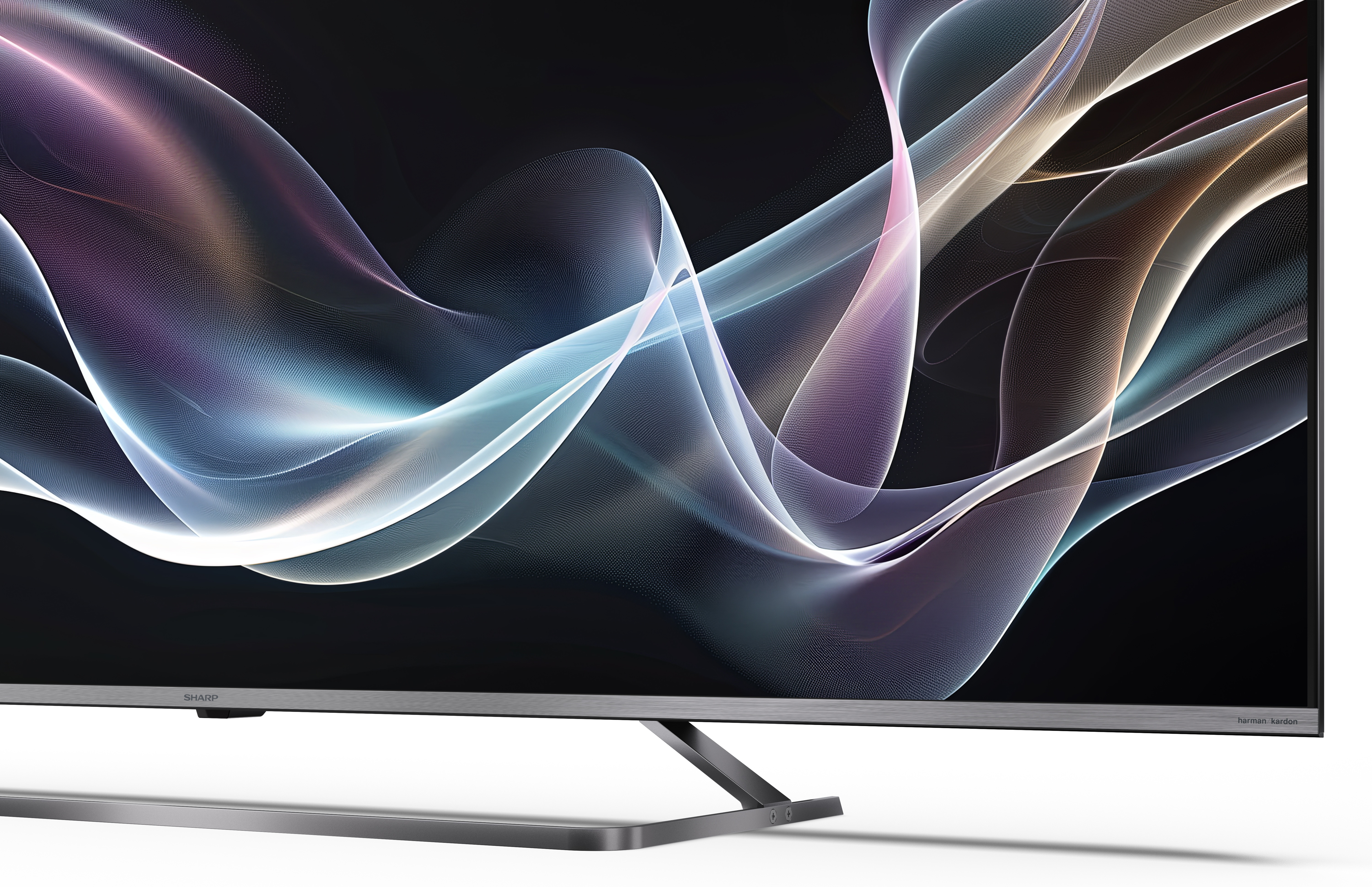 Nowoczesny telewizor wyświetla abstrakcyjne, płynące linie w różnych kolorach na ciemnym tle, z metalową podstawą.