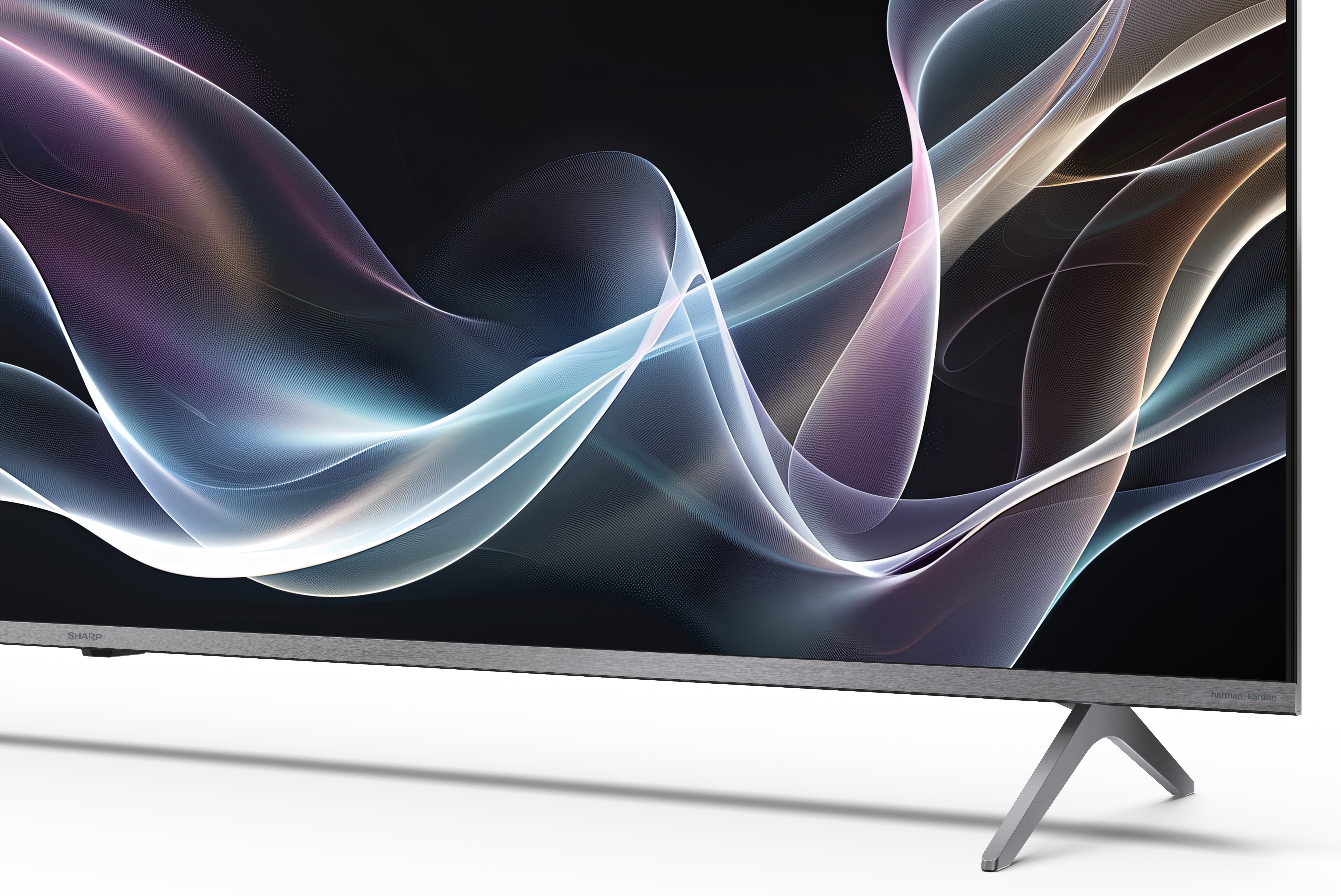 Duży telewizor z płaskim ekranem z płynnym, abstrakcyjnym wzorem. Telewizor jest srebrny ze stojakiem.