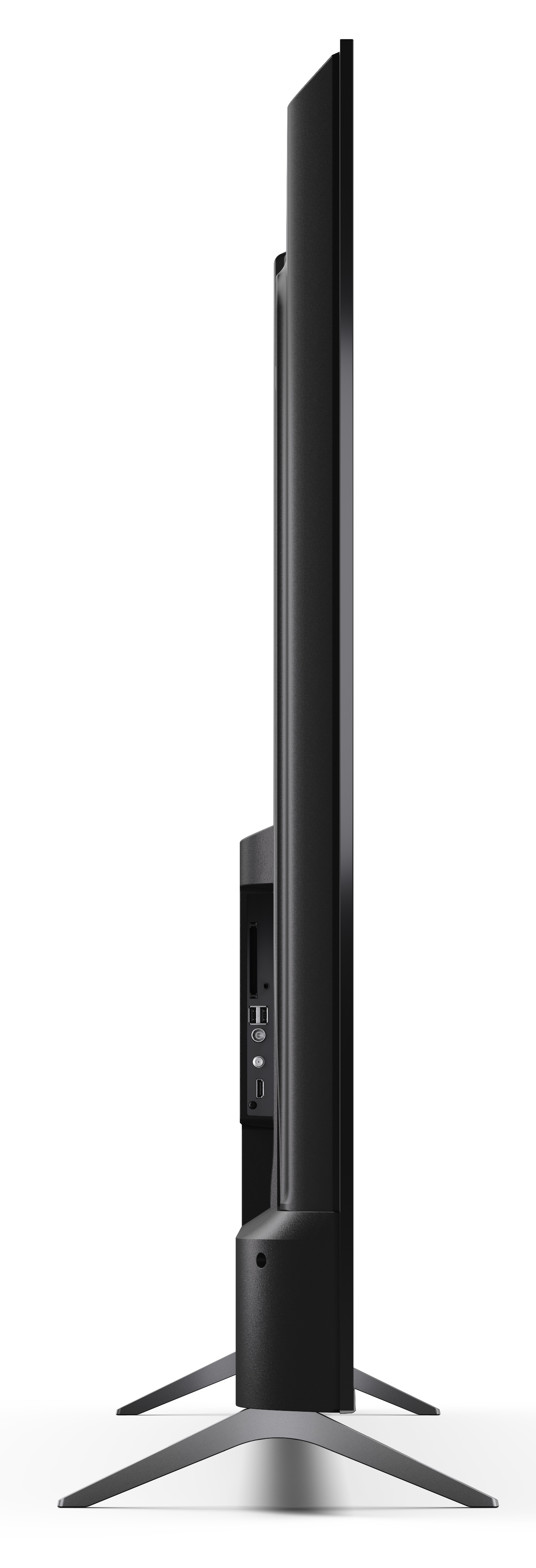 Widok z boku czarnego telewizora. Stoi na dwóch srebrnych nogach. Na boku telewizora widoczne są różne porty.