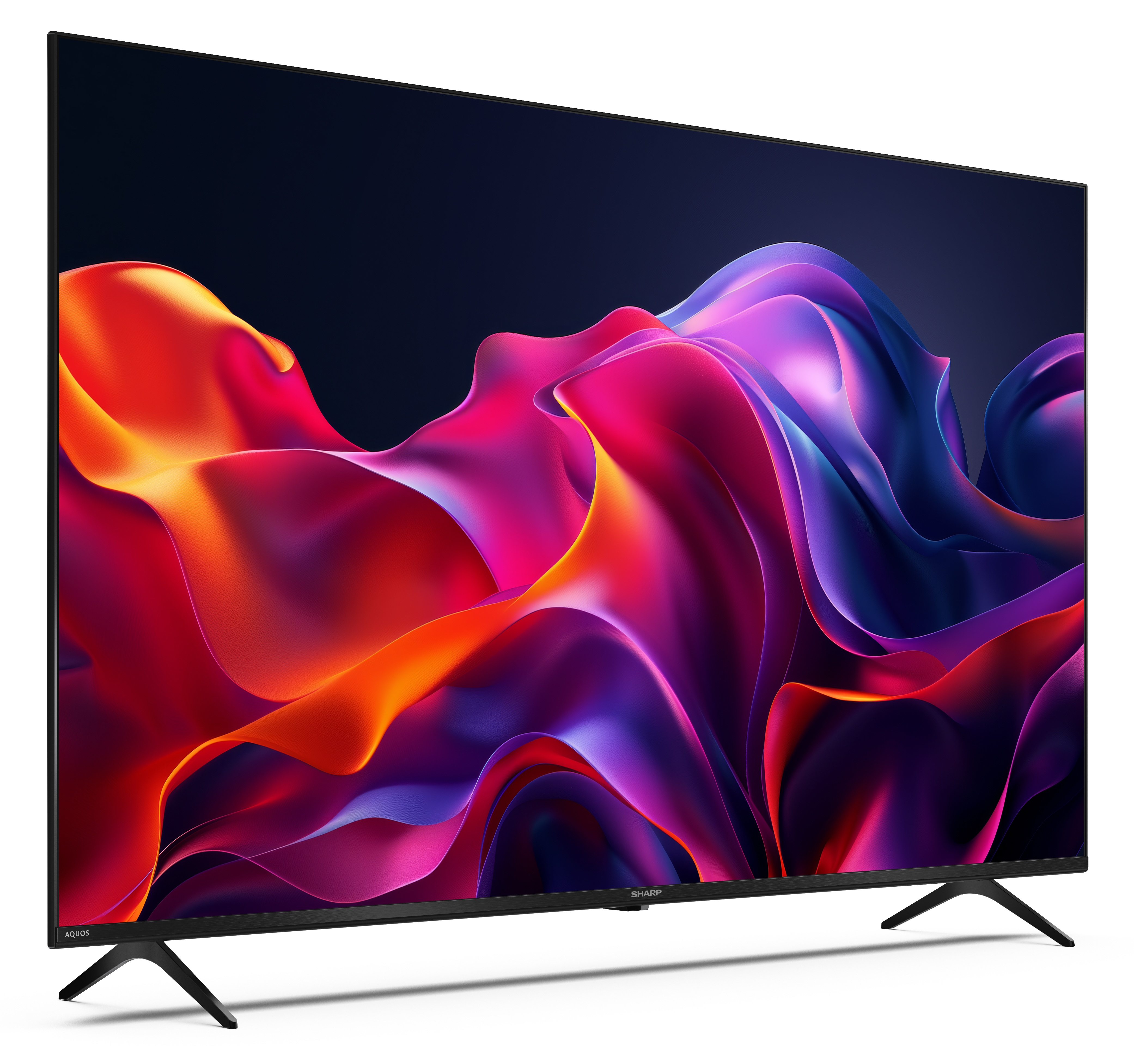 Duży, czarny telewizor Sharp wyświetla kolorową sztukę abstrakcyjną. Telewizor stoi na czarnych nogach.
