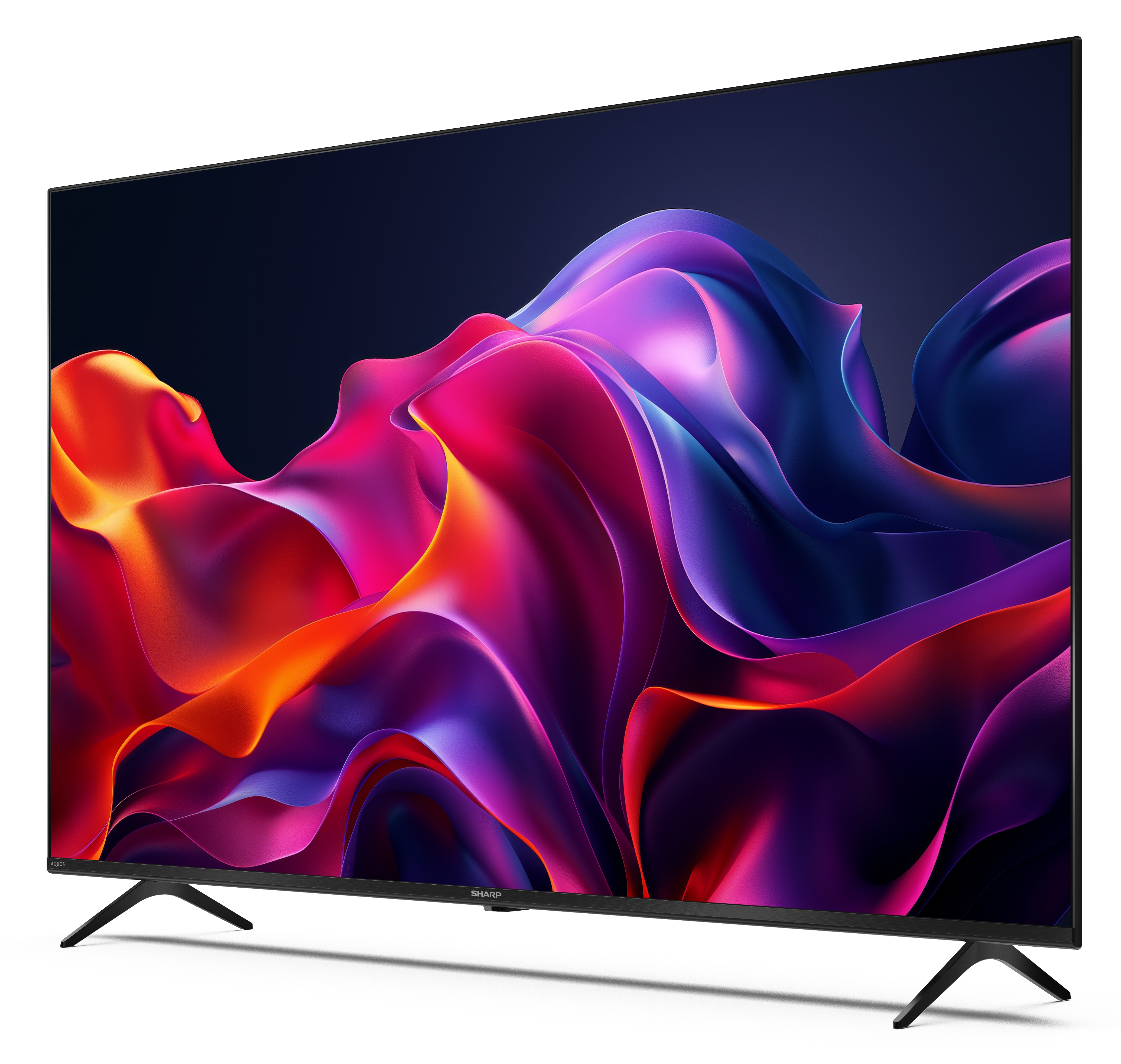 Telewizor Sharp wyświetla kolorową, abstrakcyjną grafikę. Ma czarne nogi, czarną ramę i białe tło.