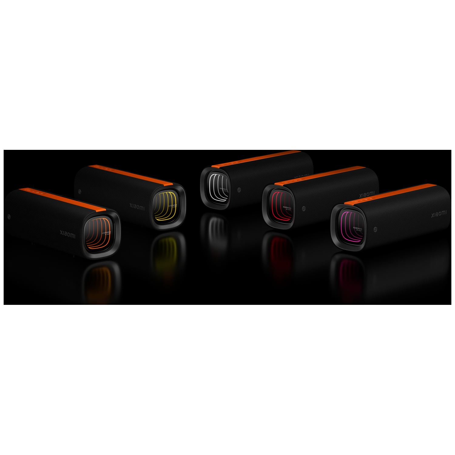Six black and orange speakers with illuminated interiors in various colors, arranged on a reflective black surface.