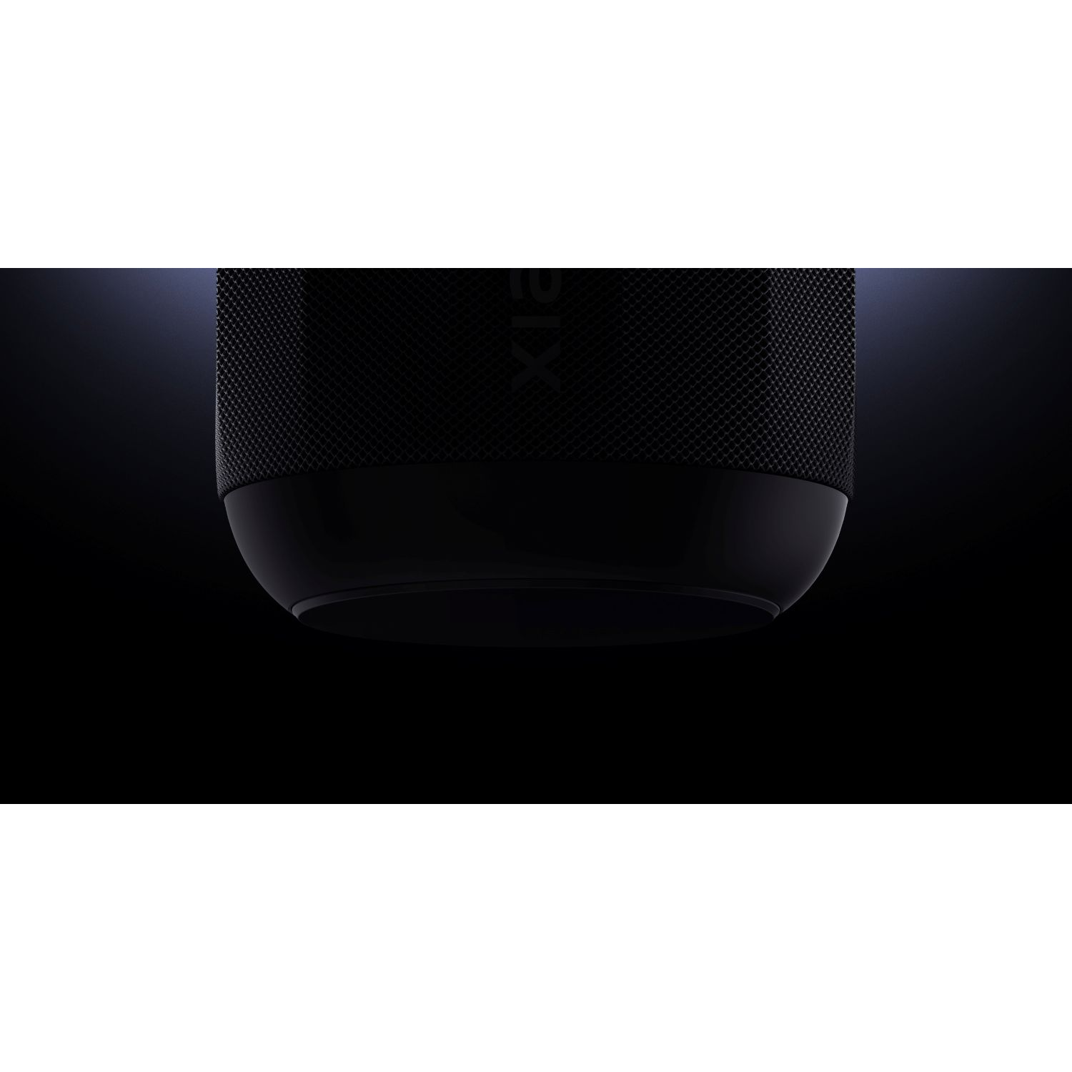 A black smart speaker. It has a textured upper section and a smooth, rounded base. The background is black.