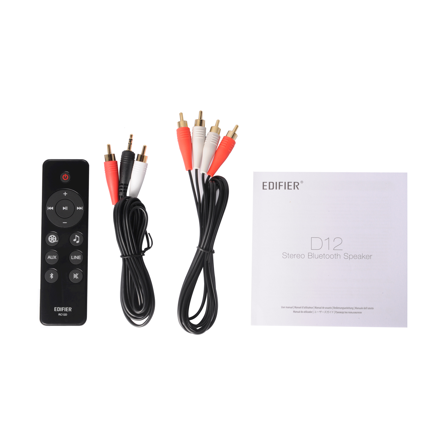 Un telecomando nero, cavi e un manuale per un altoparlante Bluetooth stereo Edifier D12.