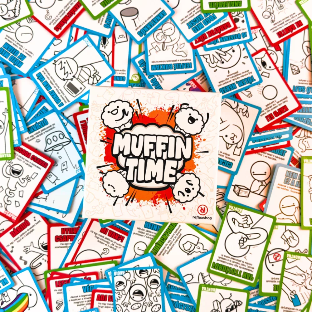 Muffin Time kártyajáték, középső logóval és sok más kártyával körülötte. A kártyákon rajzok és szöveg látható.