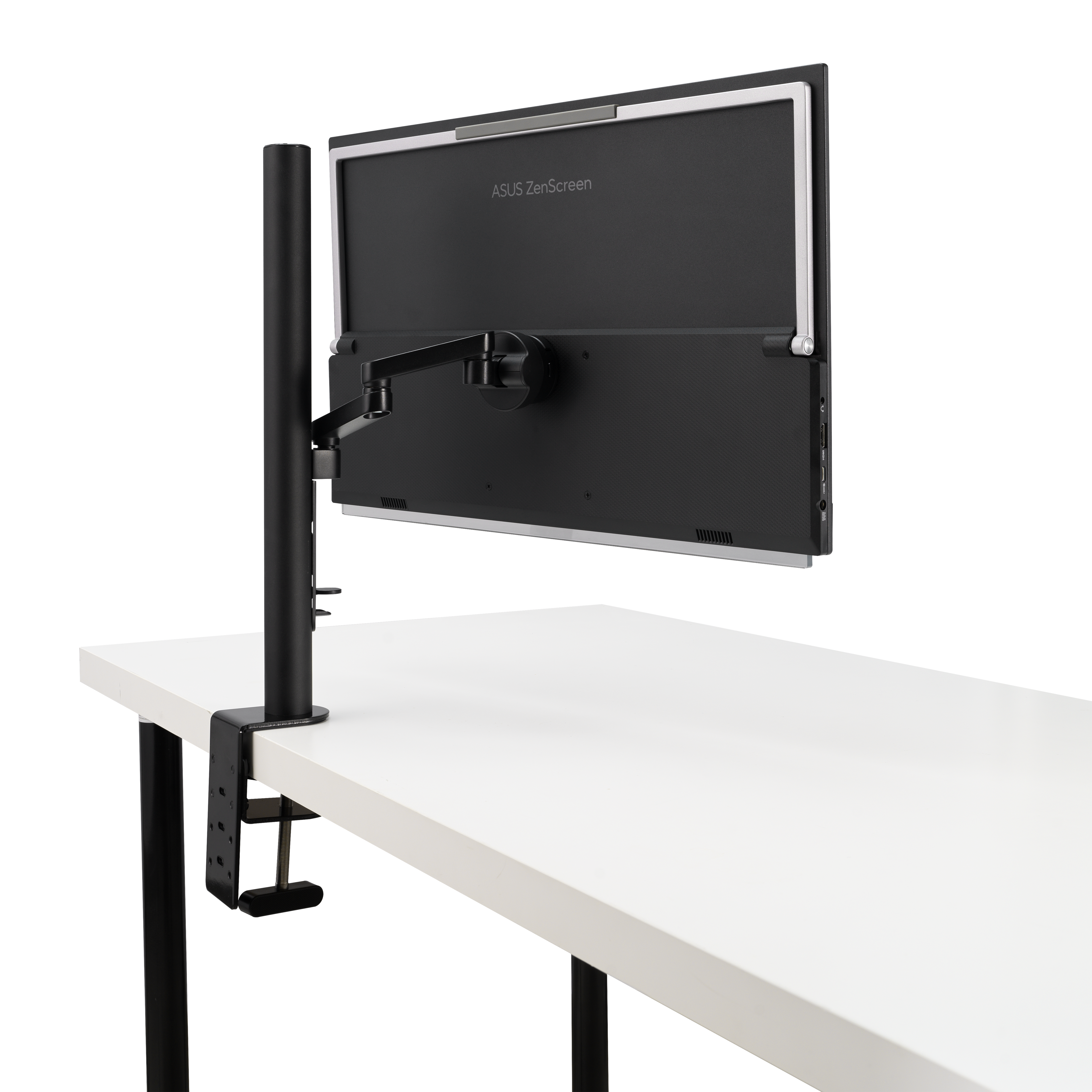 Fekete monitor fehér asztalon, fekete karral és állvánnyal. ASUS ZenScreen márkajelzés.