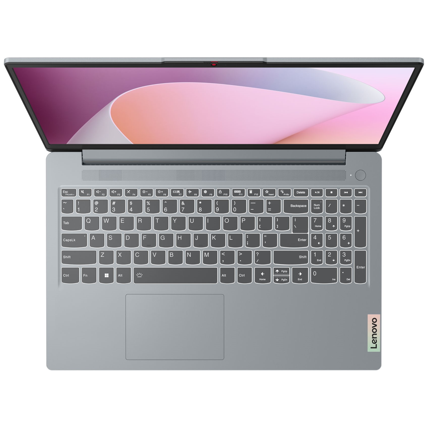 Top view of a gray Lenovo laptop with the screen open. The keyboard and touchpad are visible, with a screen showing a pink design.