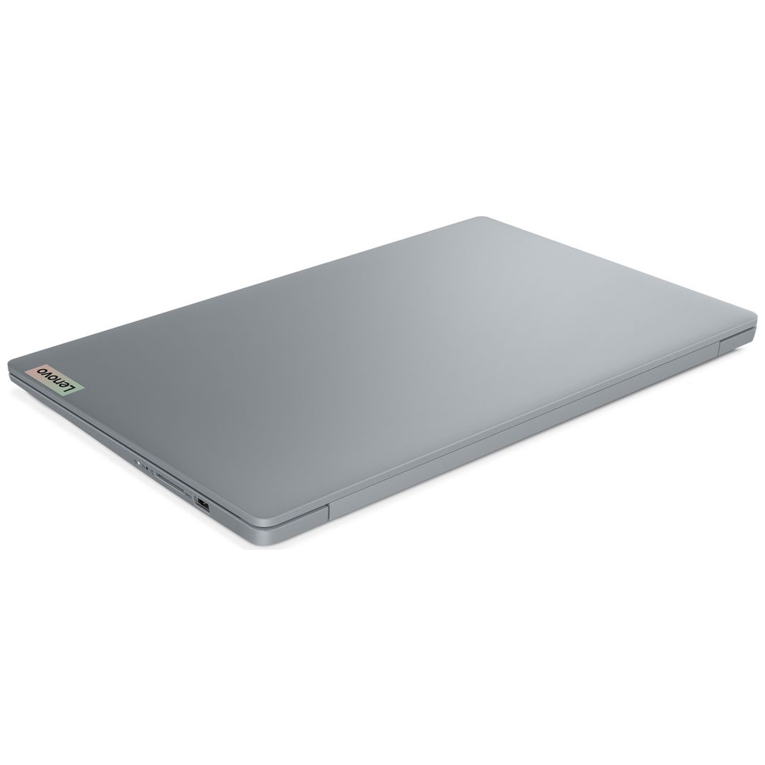 A closed, grey Lenovo laptop sits at an angle on a white background. The Lenovo logo is visible on the top left corner.