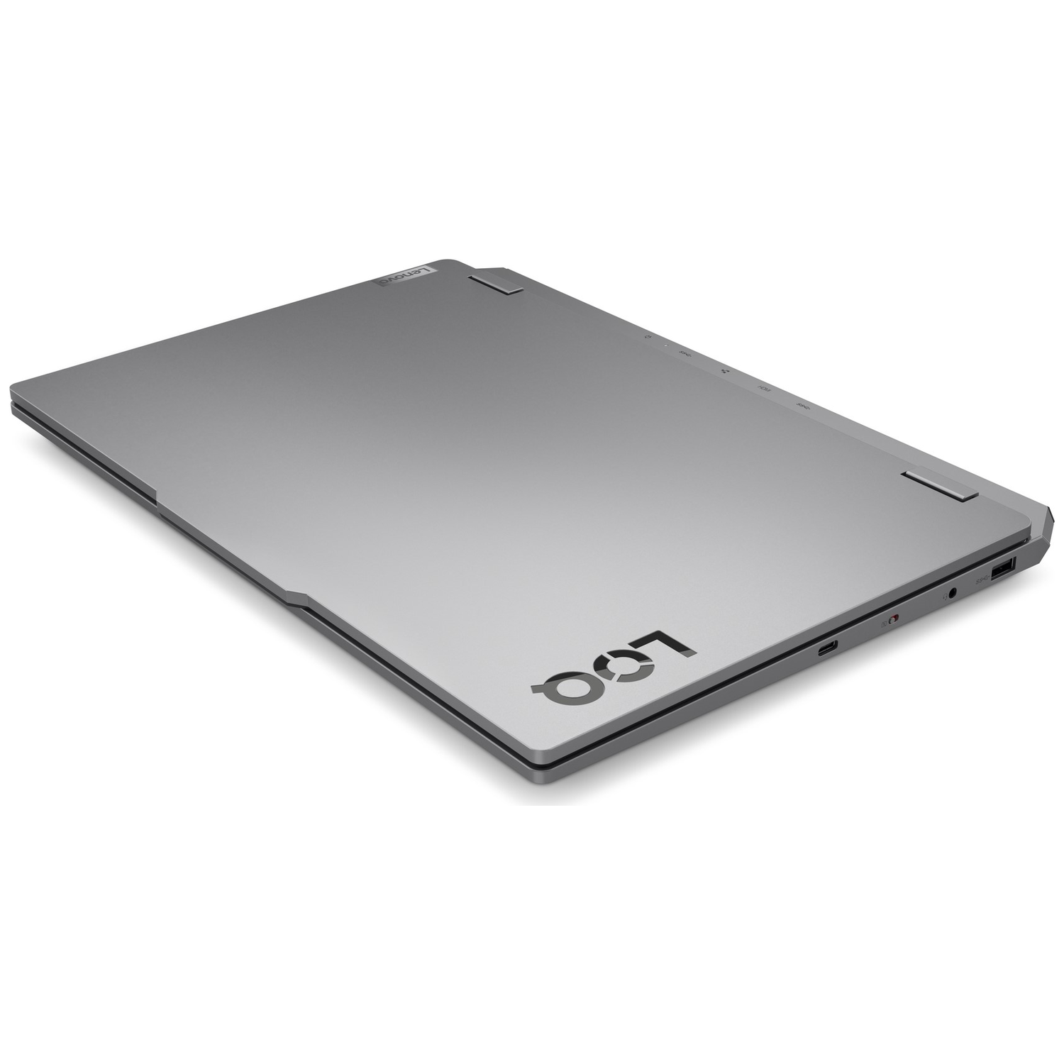 A closed, gray Lenovo laptop is angled slightly. The keyboard side is visible, with the logo 'LOQ' printed. The background is white.