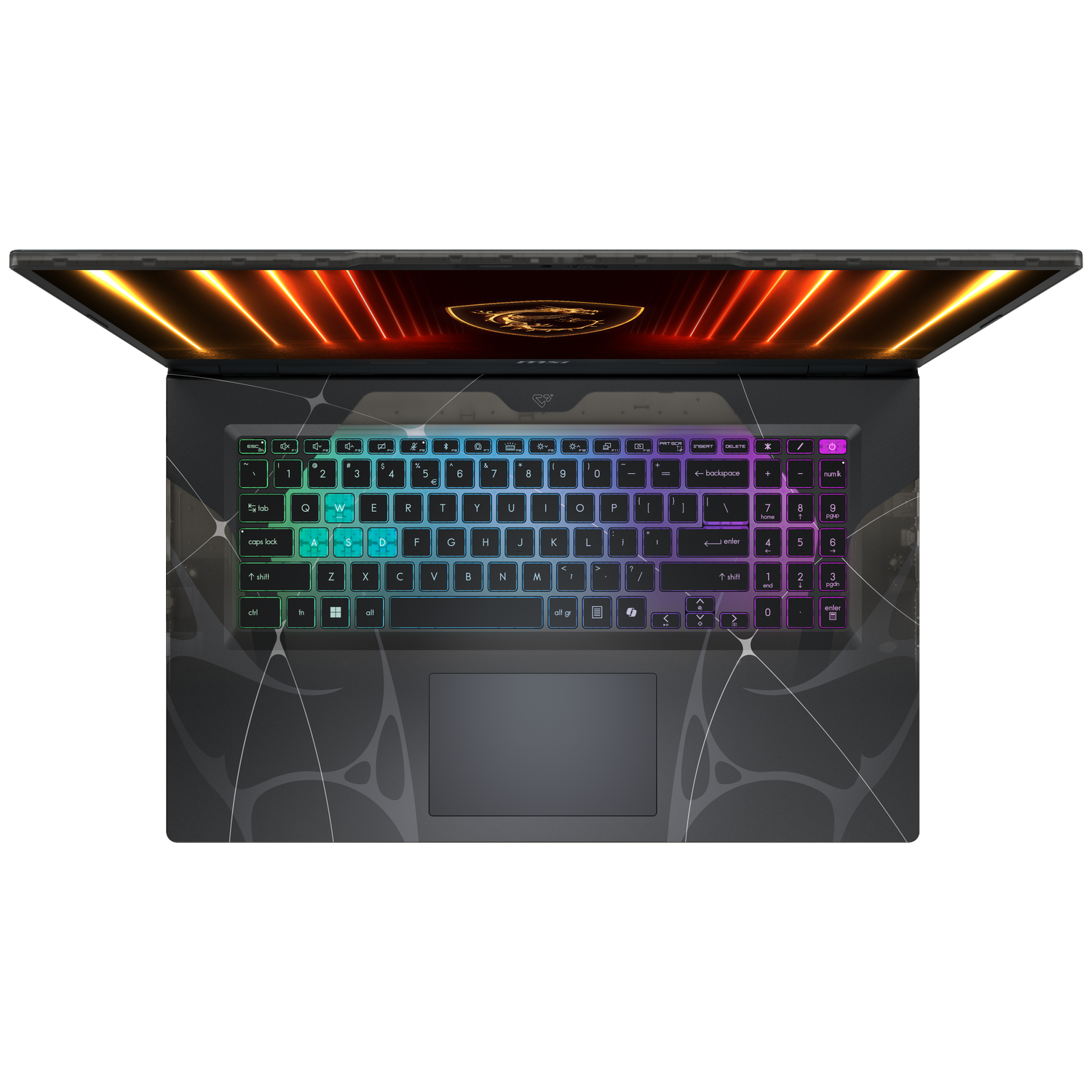 Top-down view of a laptop. The keyboard is lit with rainbow colors. The screen displays orange and gold graphics.