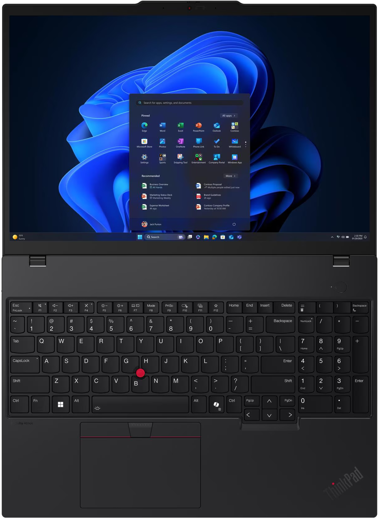 Fekete ThinkPad laptop, Windows 11 felülettel. Billentyűzet látható. A képernyő alkalmazásikonokat és kék absztrakt hátteret mutat.