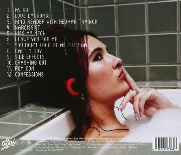 Albumcover mit einer Frau in einer Badewanne. Sie hat rote Kopfhörer und berührt ihre Lippen. Songtitel sind aufgeführt.