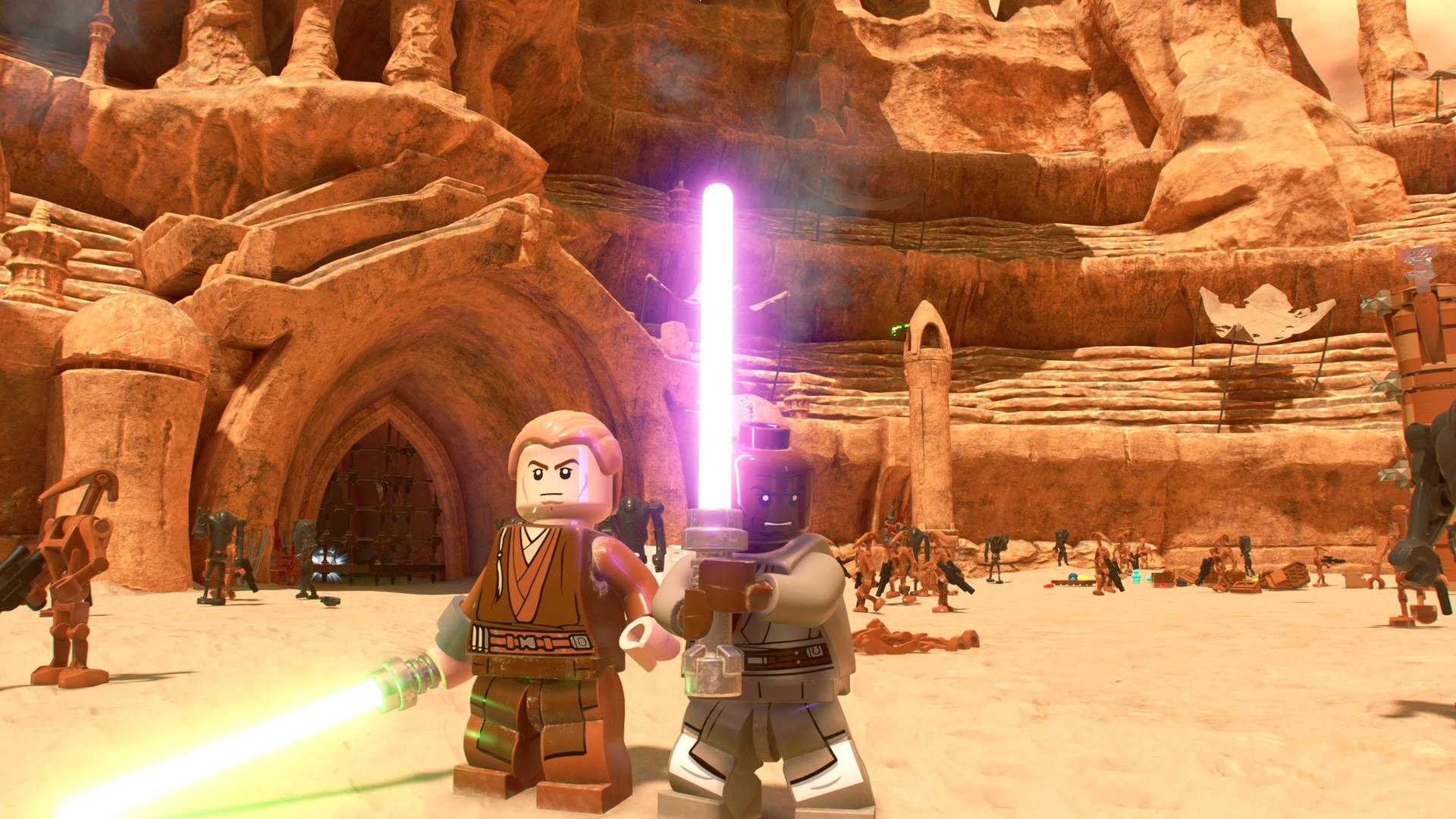 Dwie figurki Lego Star Wars z mieczami świetlnymi stoją przed skalistym kanionem, w tle scena bitwy.